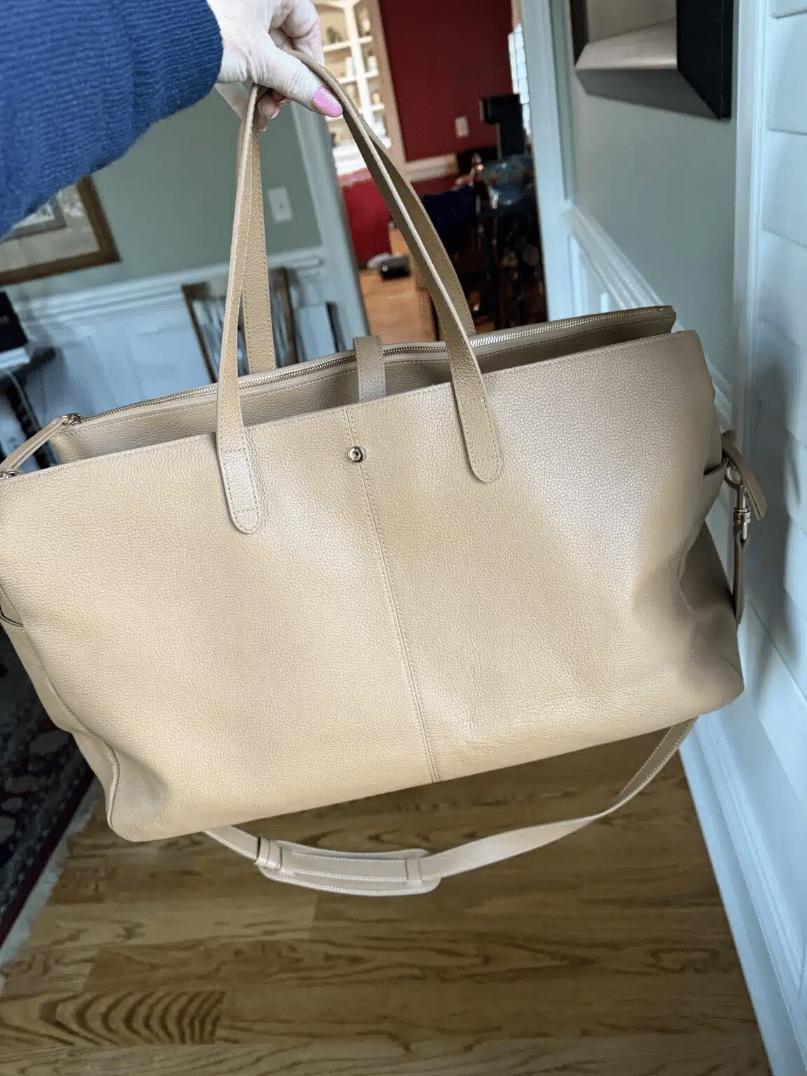 Leather weekender bag with zippered compartments, ideal for travel from Quince
