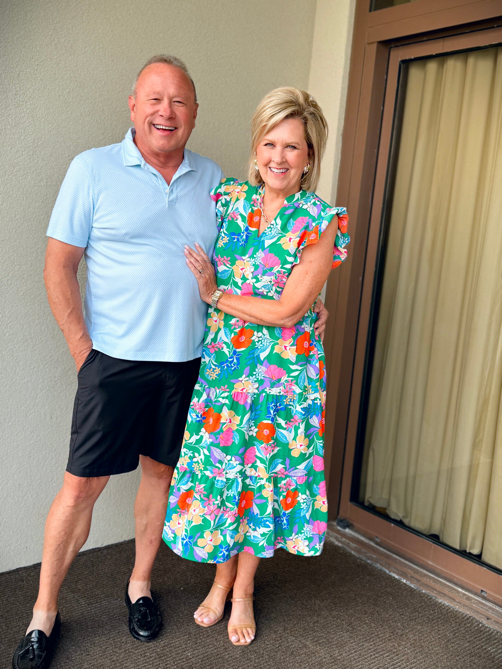 woman and man over 50 on a balcony for summer