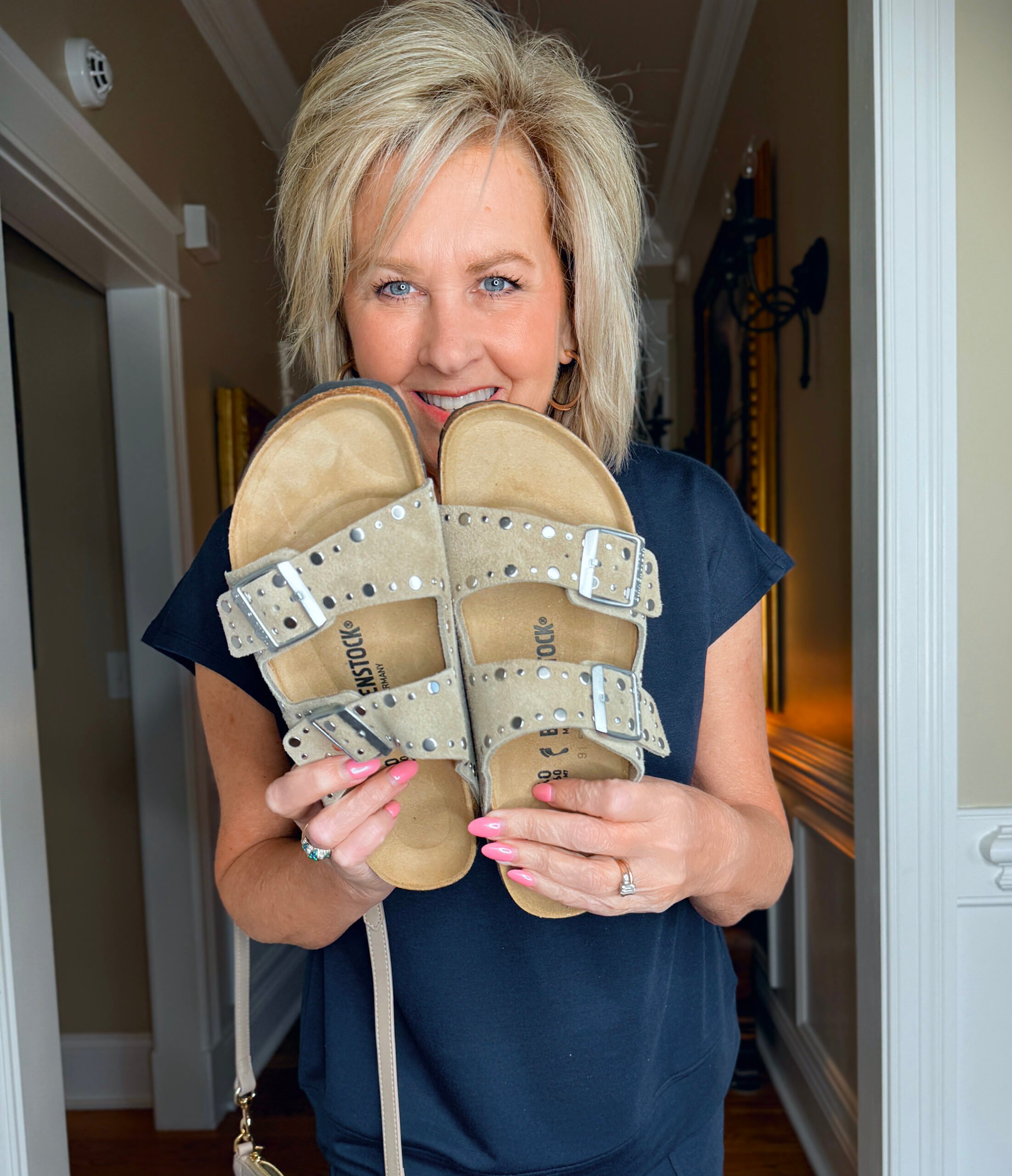 Tania Stephens showing a pair of Rivet Birkenstock sandals
