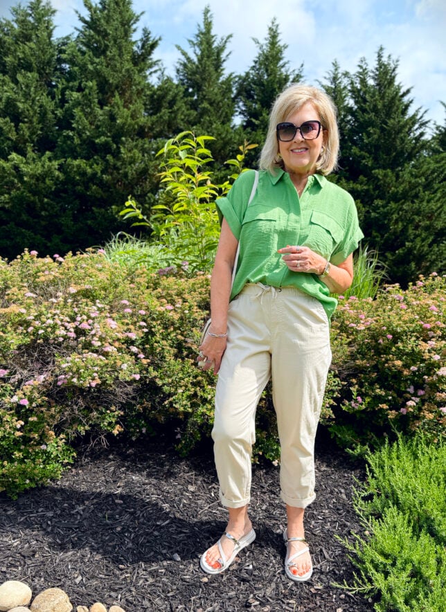 Tania Stephens wearing a green button shirt with beige chino pants