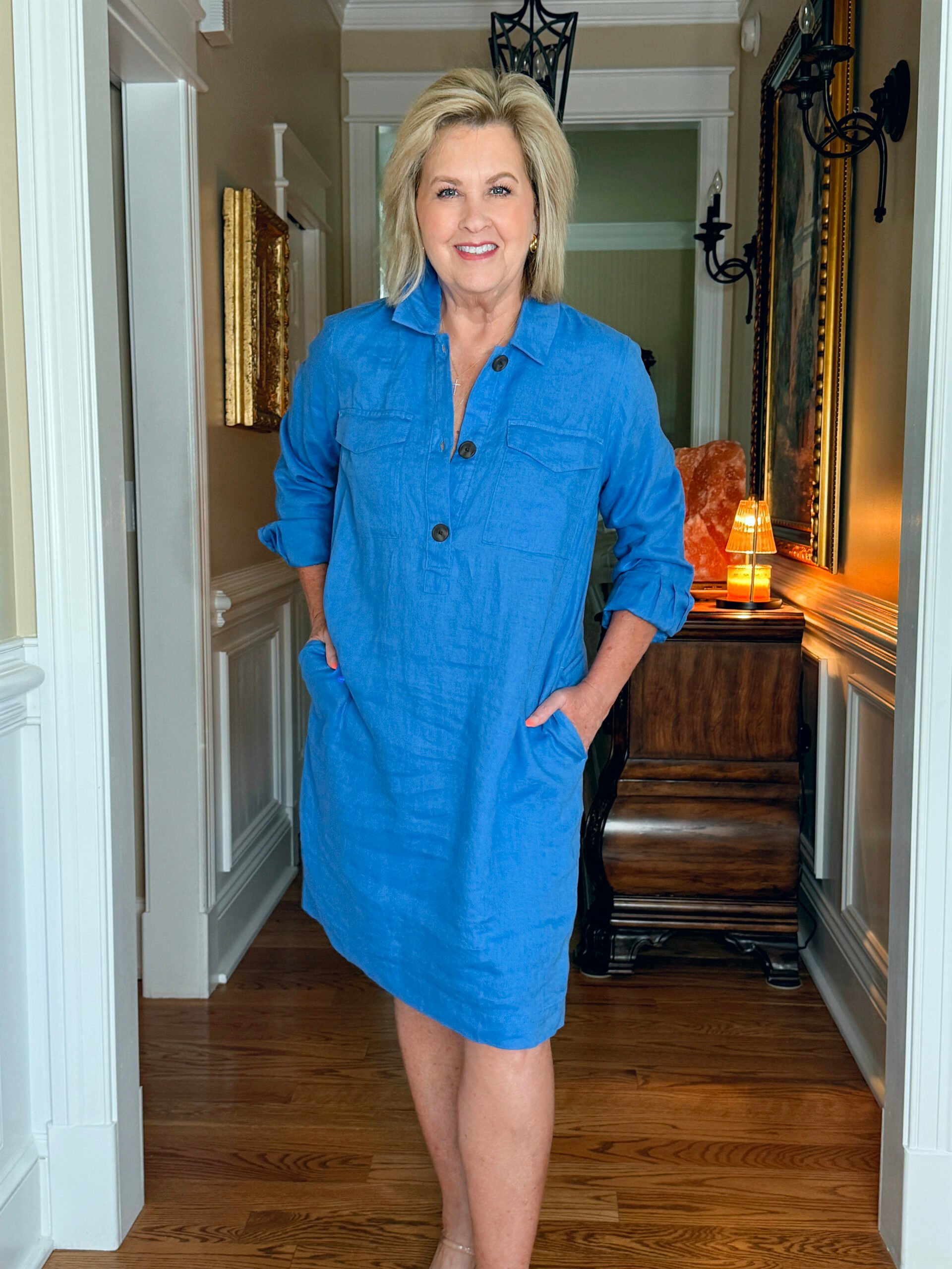 Tania wearing a long sleeve cobalt linen popover shirtdress with front pockets and a relaxed fit