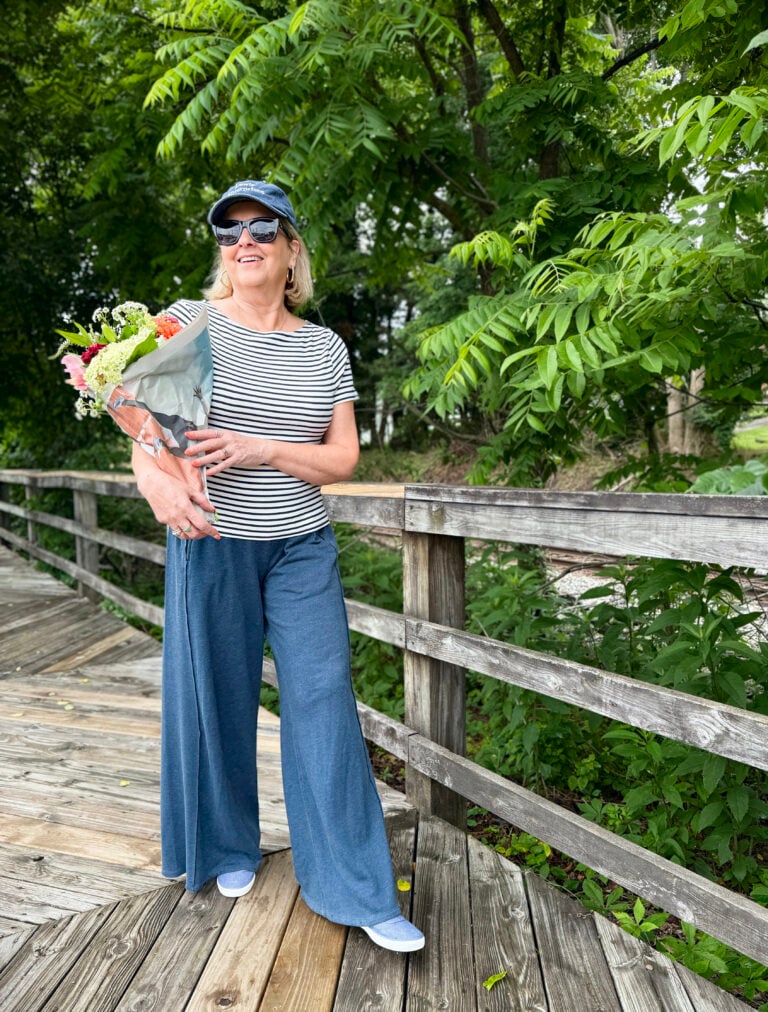 woman walking on wooden path