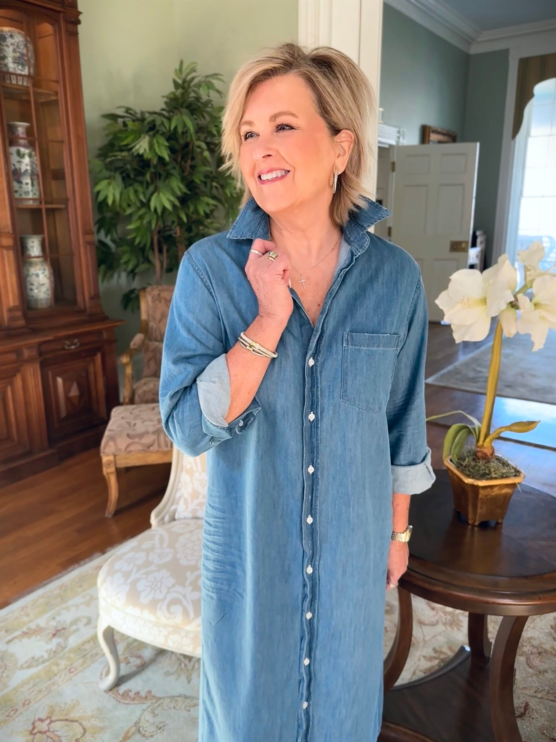 Tania Stephens from 50 Is Not Old standing in a living room