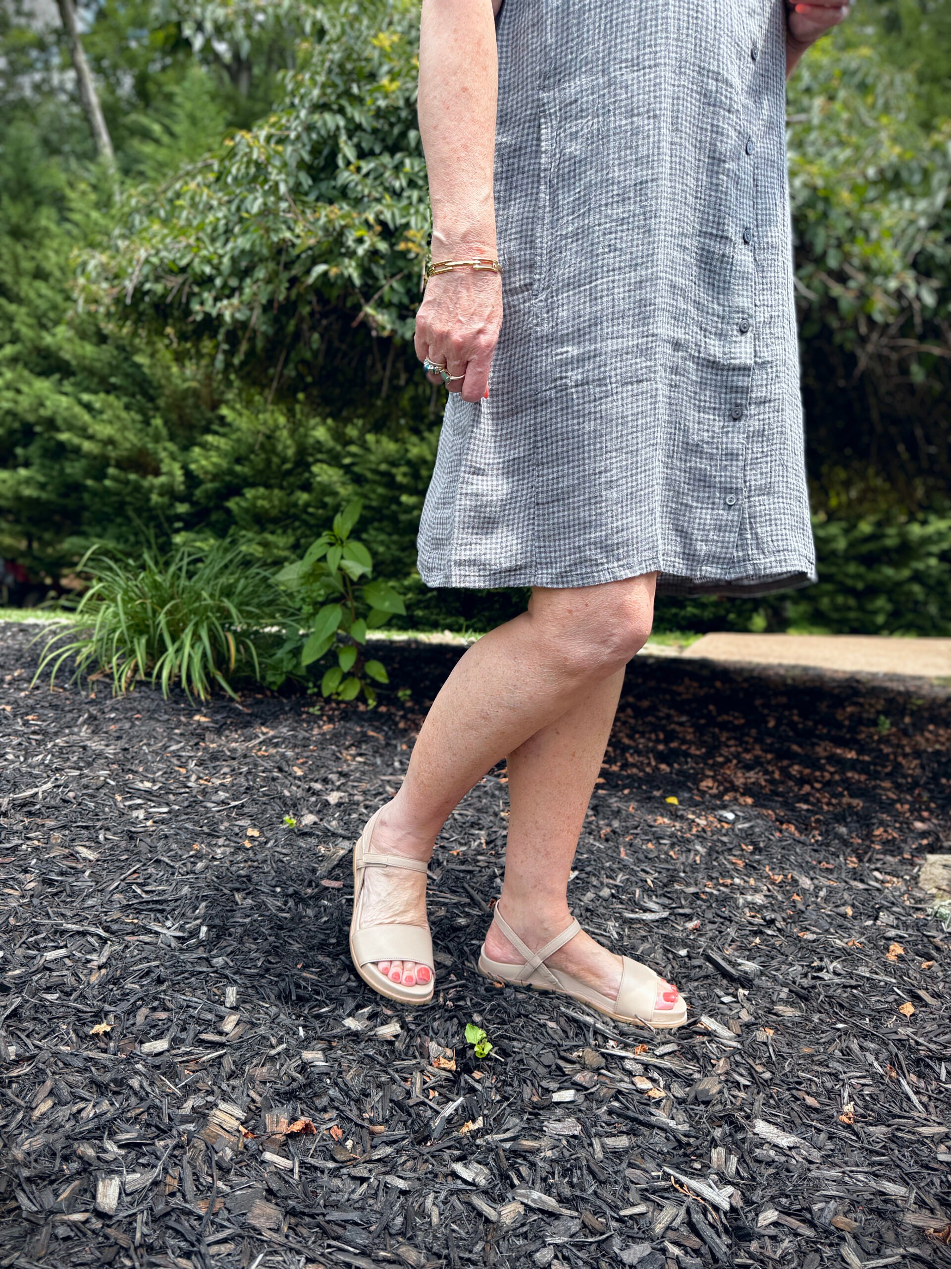 Tania wearing an Eileen Fisher gray checked dress with neutral sandals from Nordstrom Rack