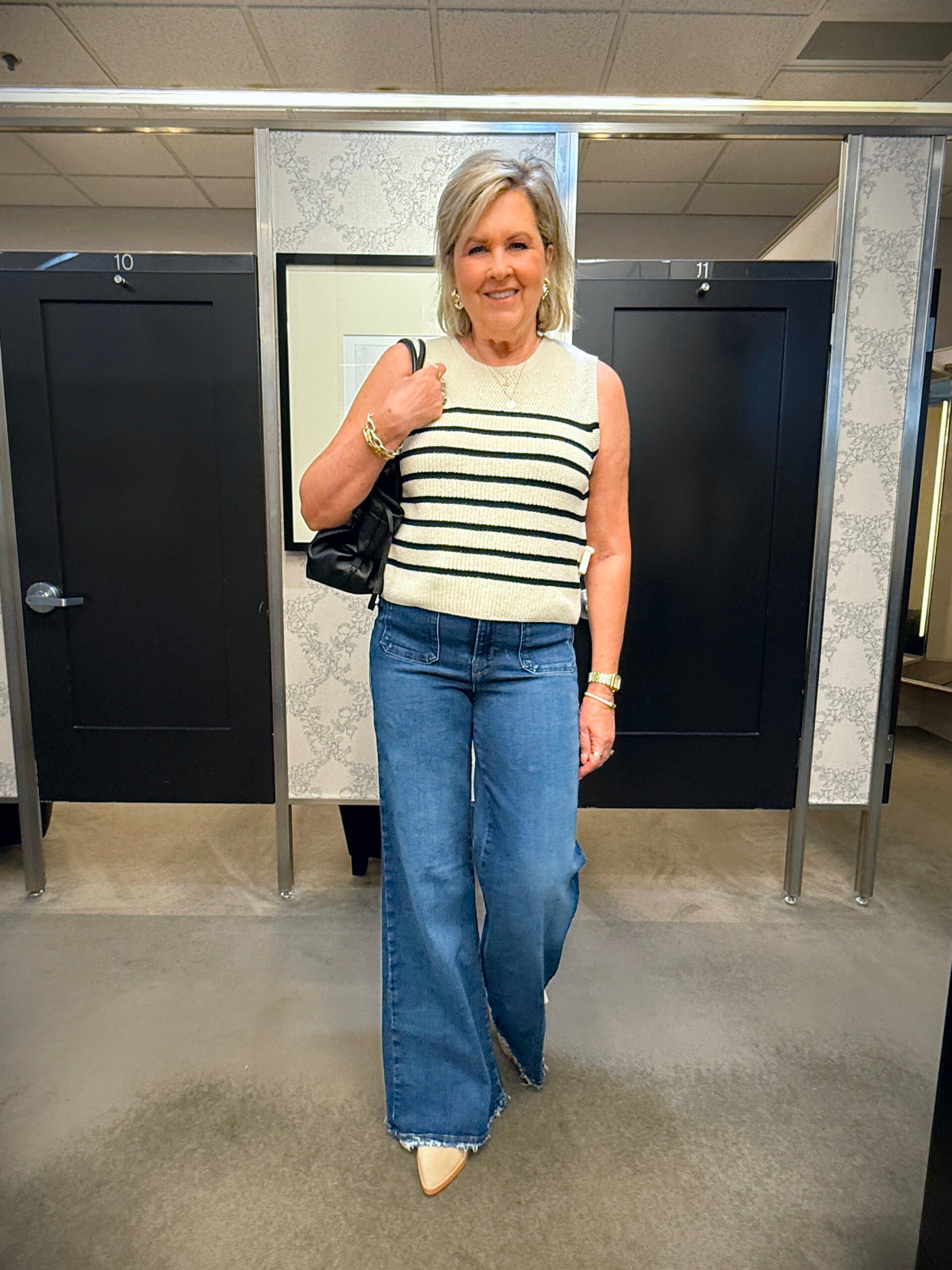 Tania wearing a striped top and jeans from the Nordstrom Anniversary Sale