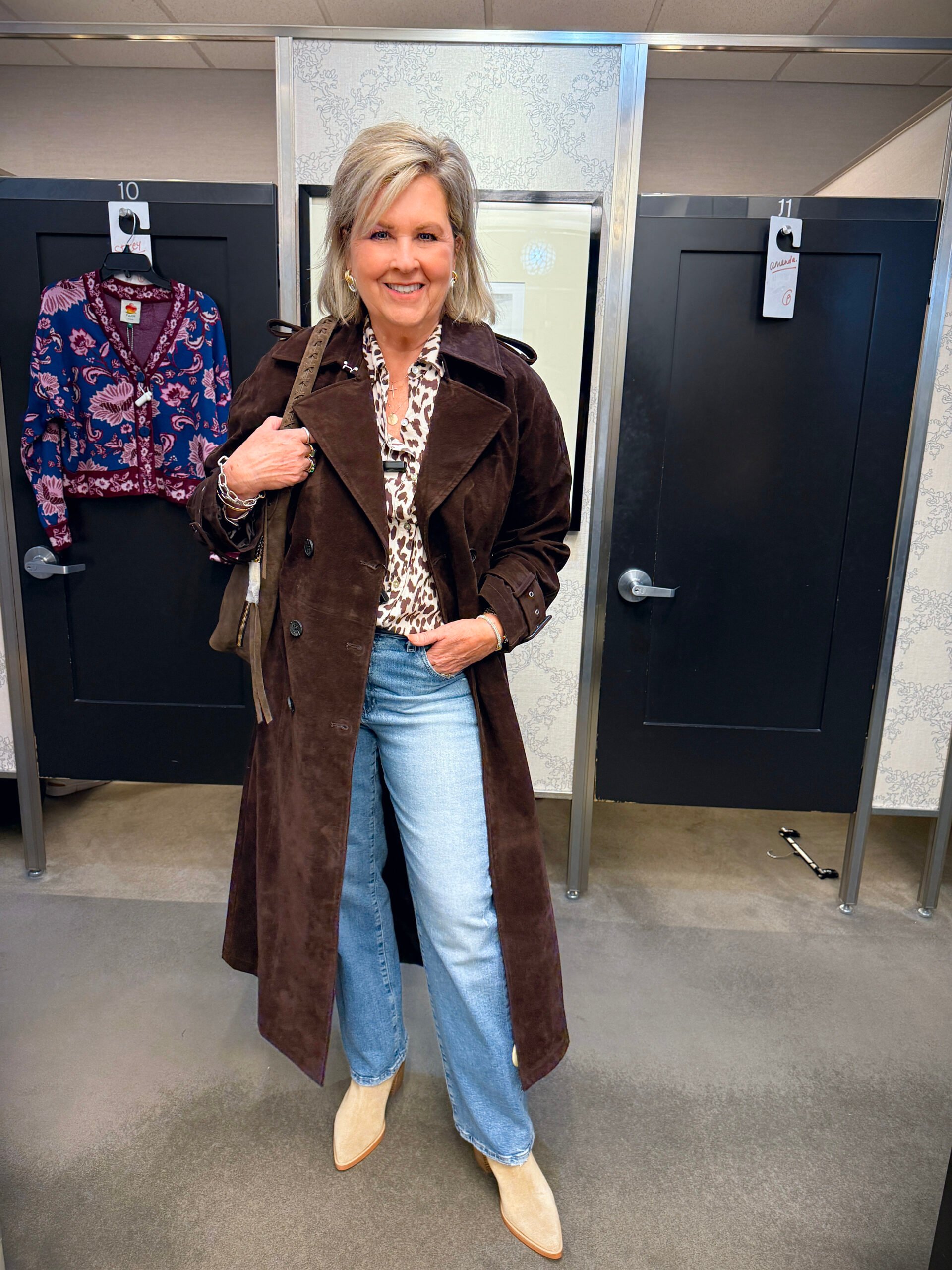 Tania wearing a chocolate brown suede coat, a printed top, and jeans from the Nordstrom Anniversary Sale