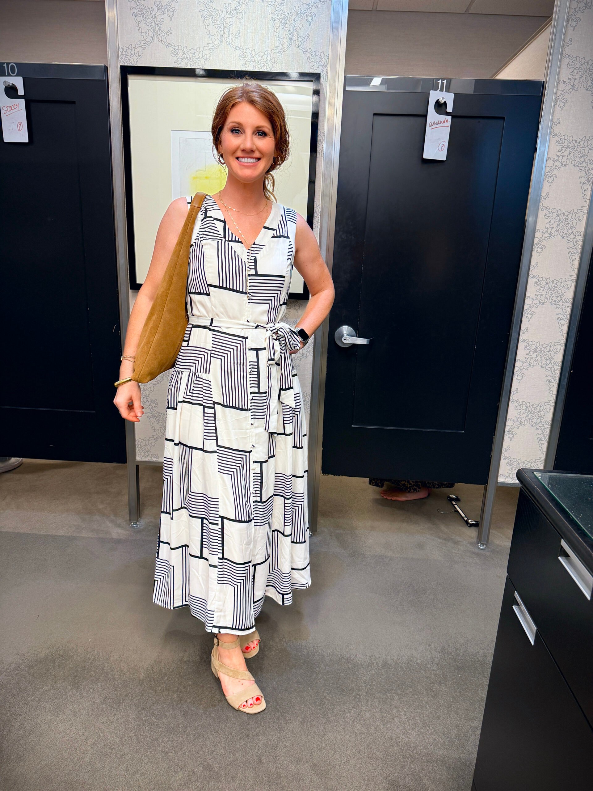 Stephanie wearing a navy & white geometric midi dress