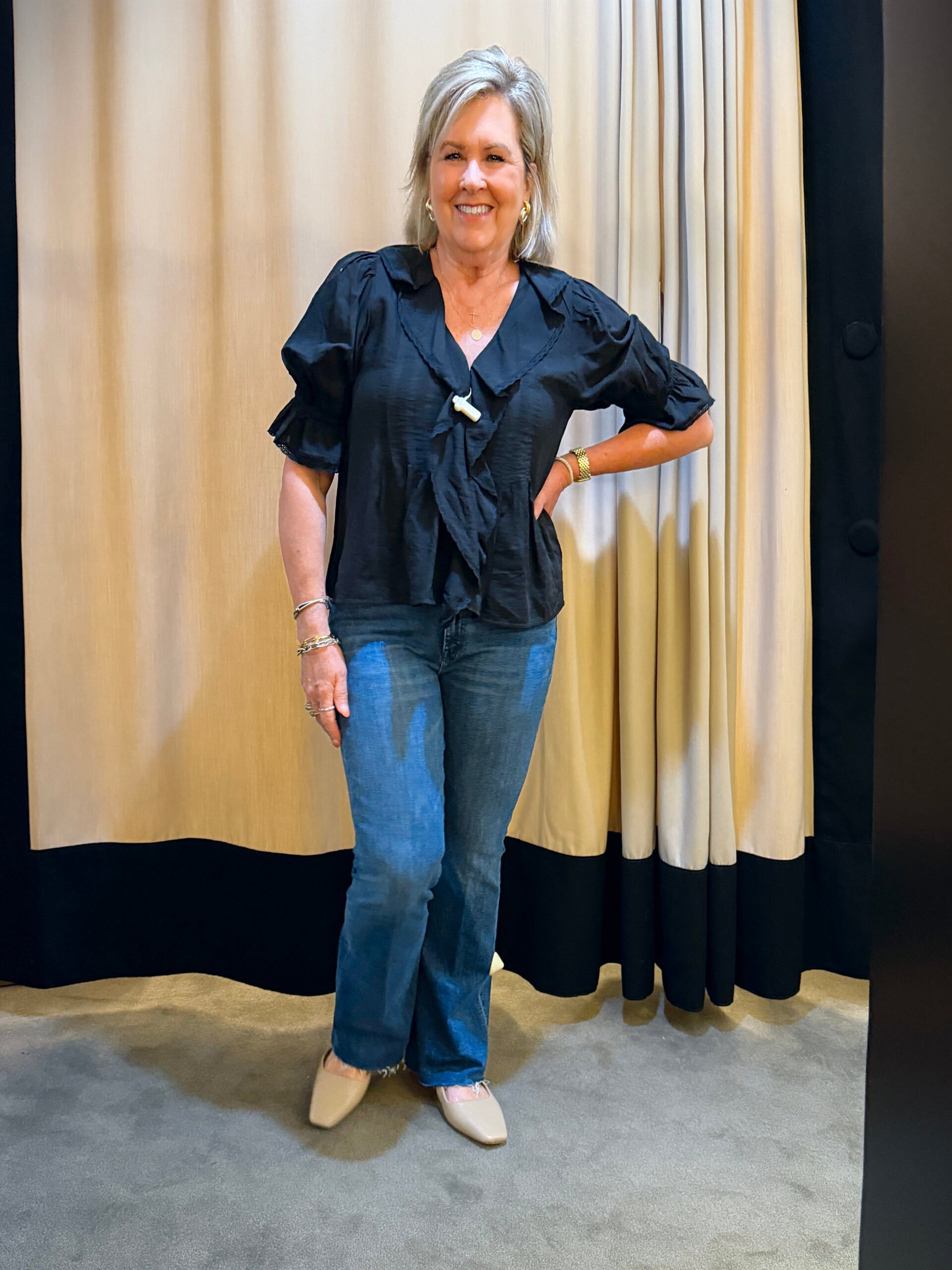 Tania wearing a black top, and jeans from the Nordstrom Anniversary Sale
