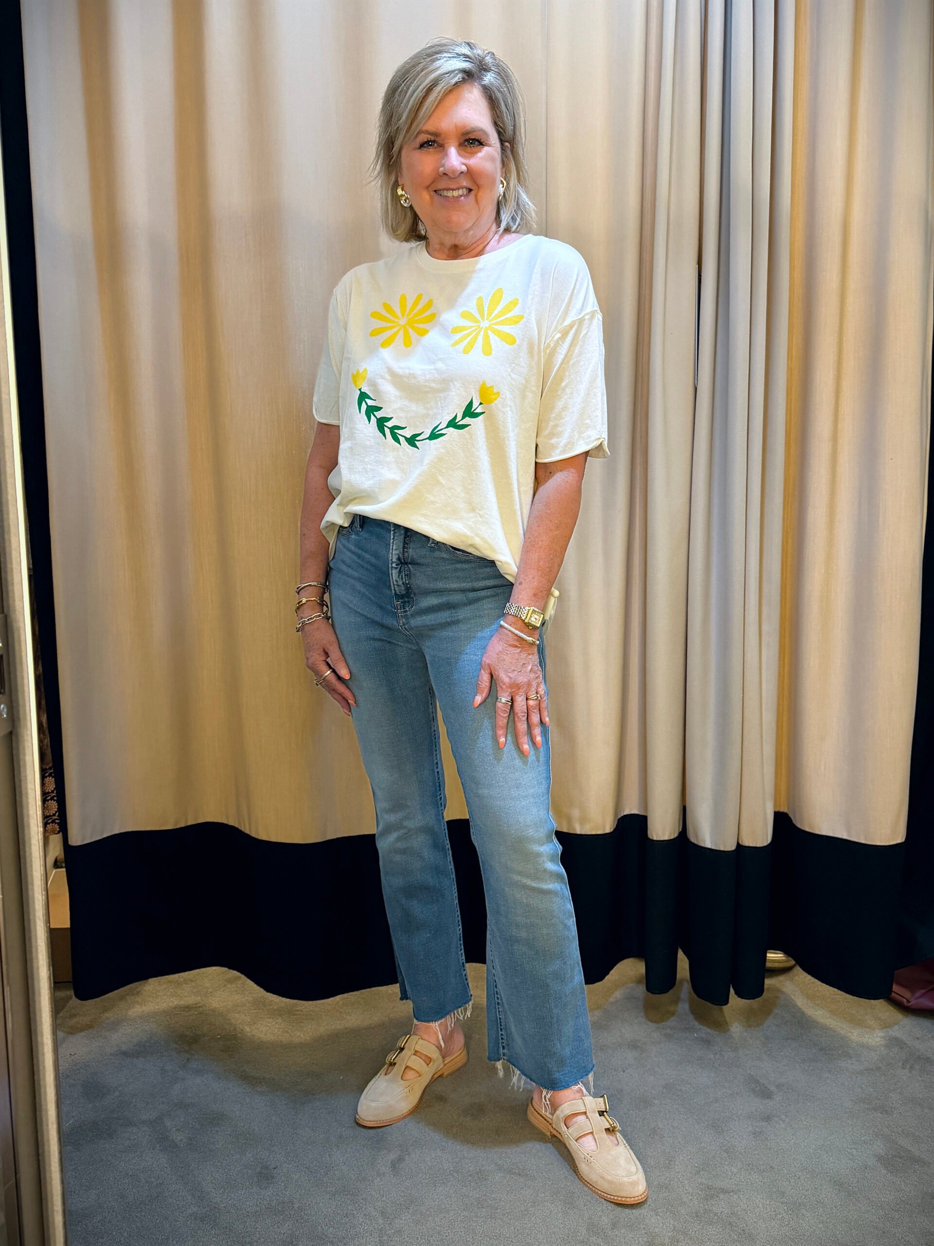 Tania wearing a Free People graphic t-shirt and jeans