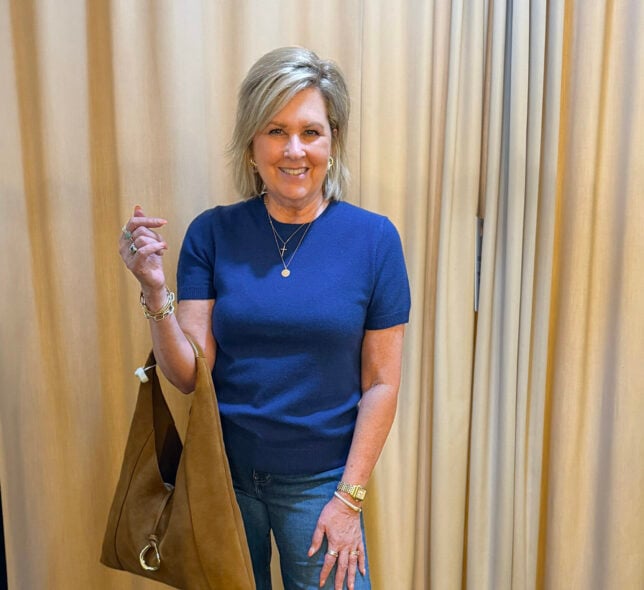 Tania wearing a cashmere blue sweater with wide leg jeans - a great fall transition outfit to wear now