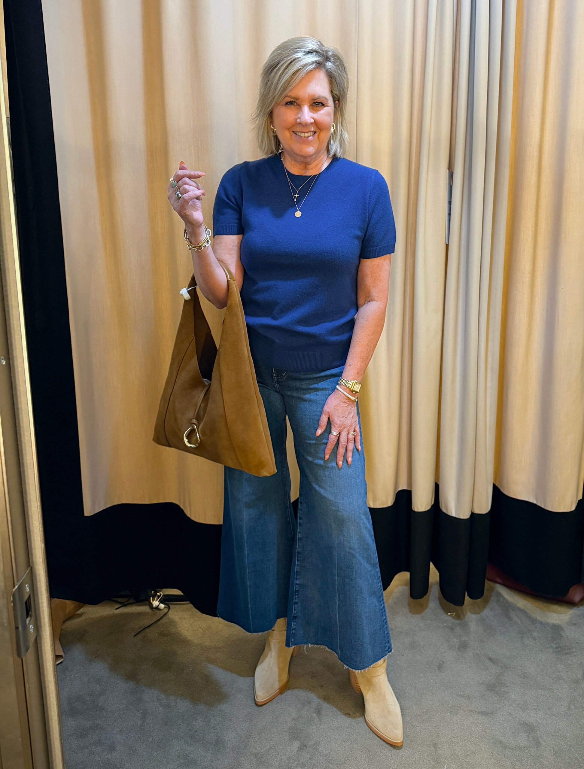 Tania wearing a cashmere blue sweater with wide leg jeans - a great fall transition outfit to wear now
