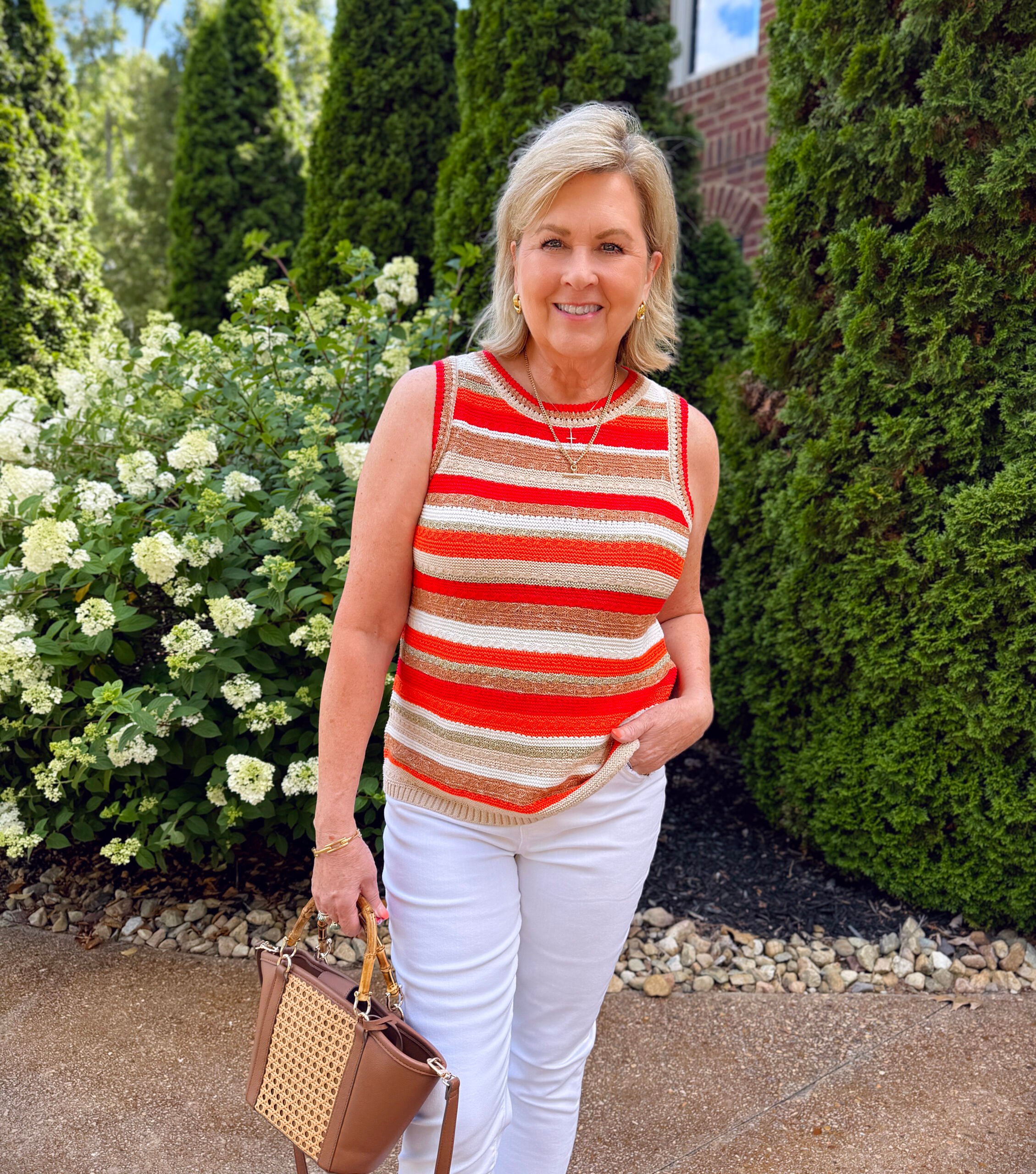 Tania wearing a striped summer tank sweater from Chico's 