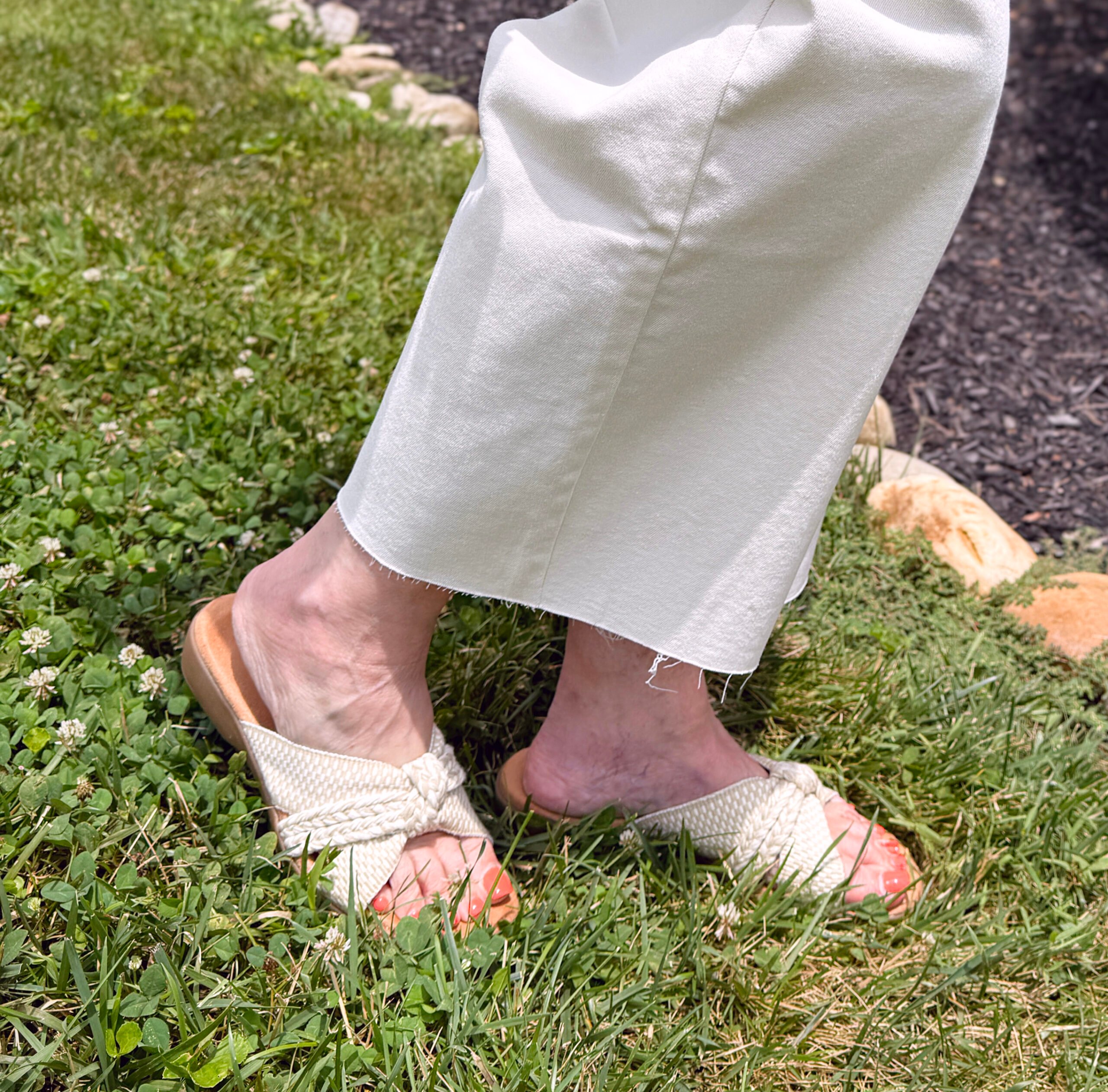 Tania Stephens wearing a neutral slip on slide from Kohls