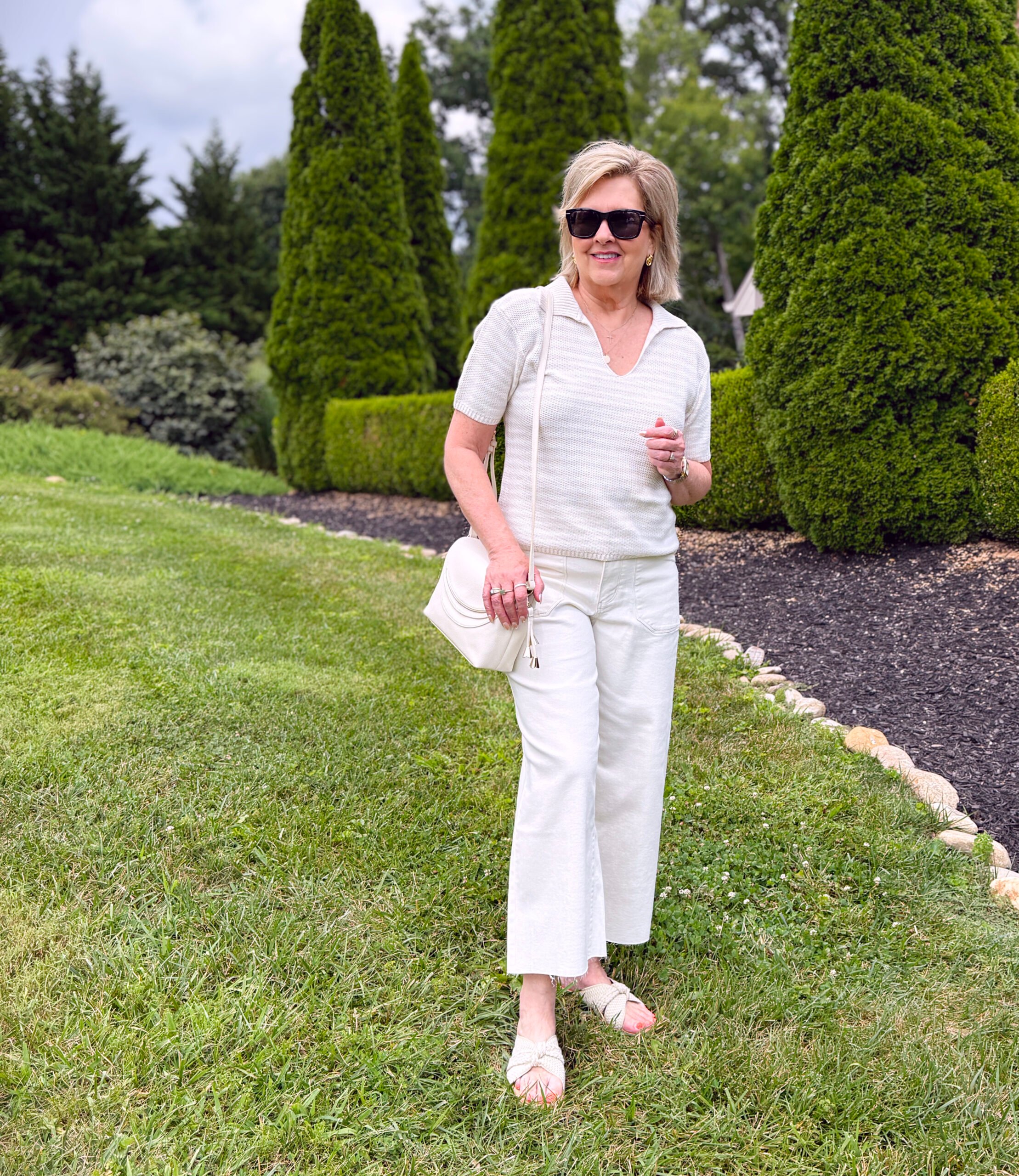 Tania Stephens wearing a neutral striped polo sweater and cream wide leg pants from Kohls