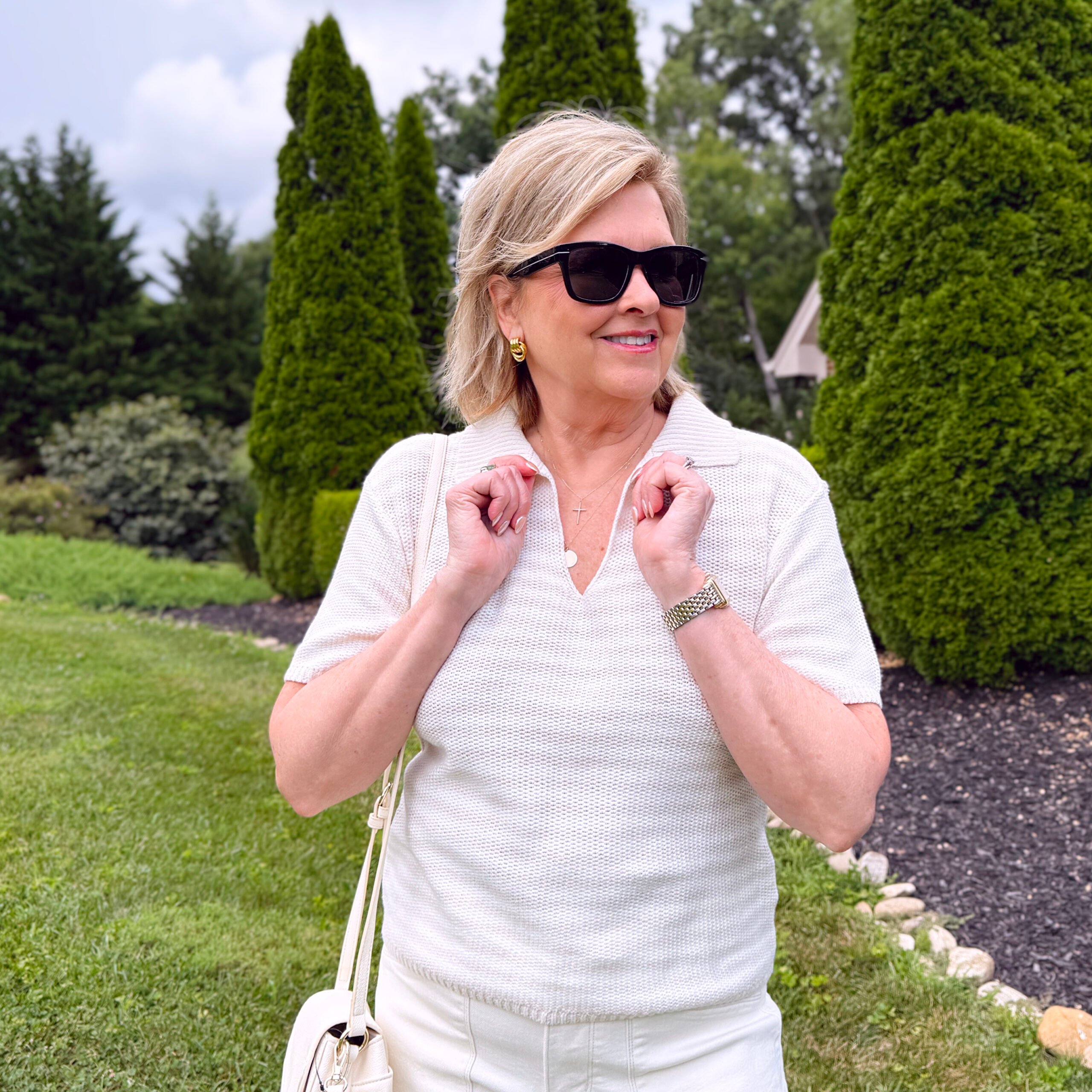 Tania Stephens wearing a neutral striped polo sweater from Kohls