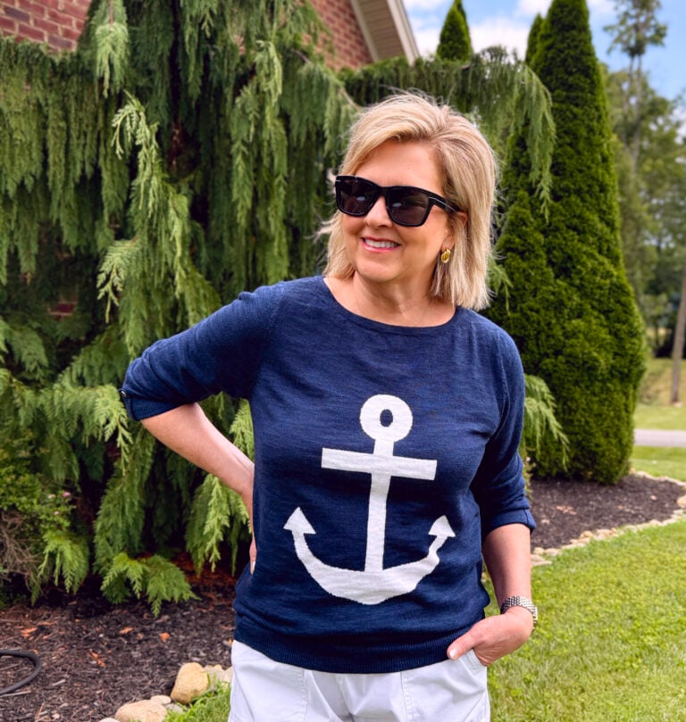 Tania Stephens wearing a nautical navy and white sweater with an anchor from Kohls