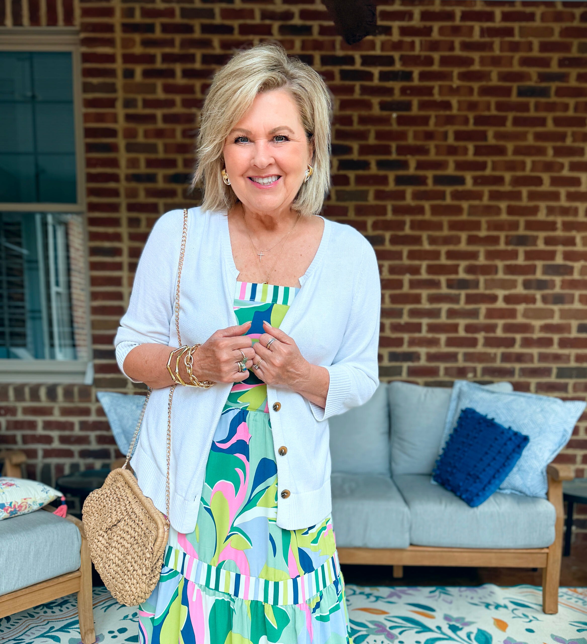Tania wearing a pink, blue, white and green maxi dress from Amazon with a white cardigan