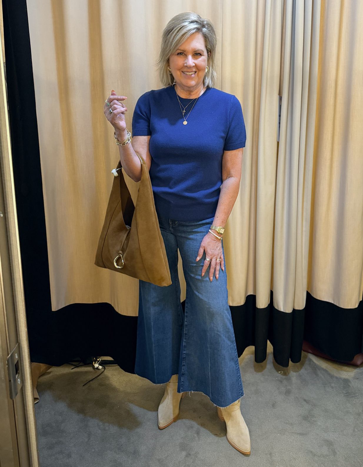 Tania wearing a cashmere blue sweater with wide leg jeans - a great fall transition outfit to wear now