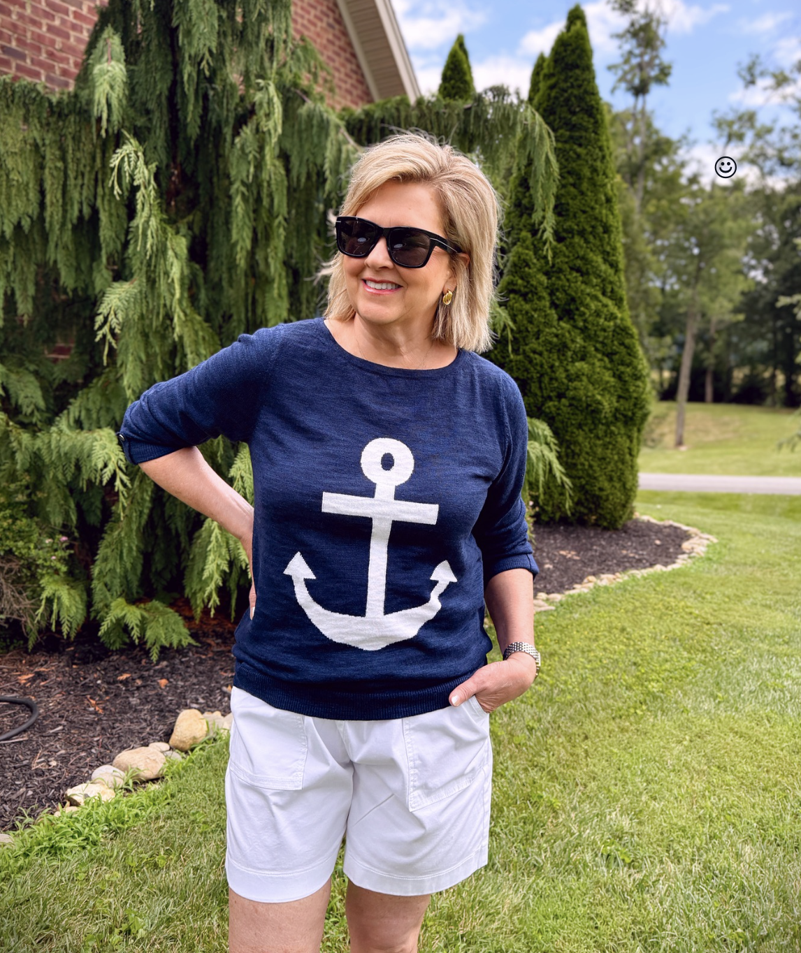 Tania Stephens wearing a nautical navy and white sweater with an anchor from Kohls