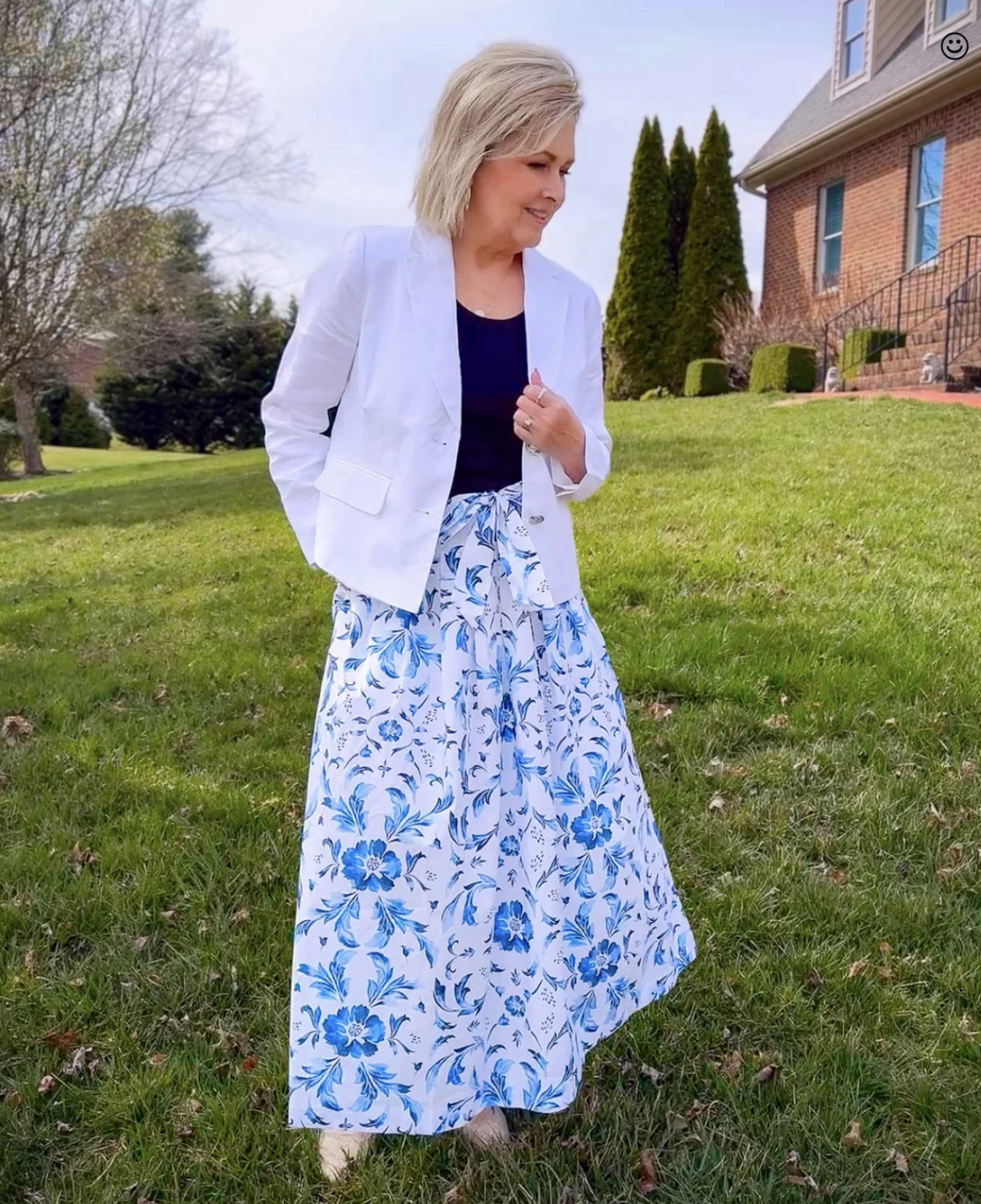 Tania Stephens wearing a Spring outfit of a linen crop jacket and a white and blue skirt from Talbots