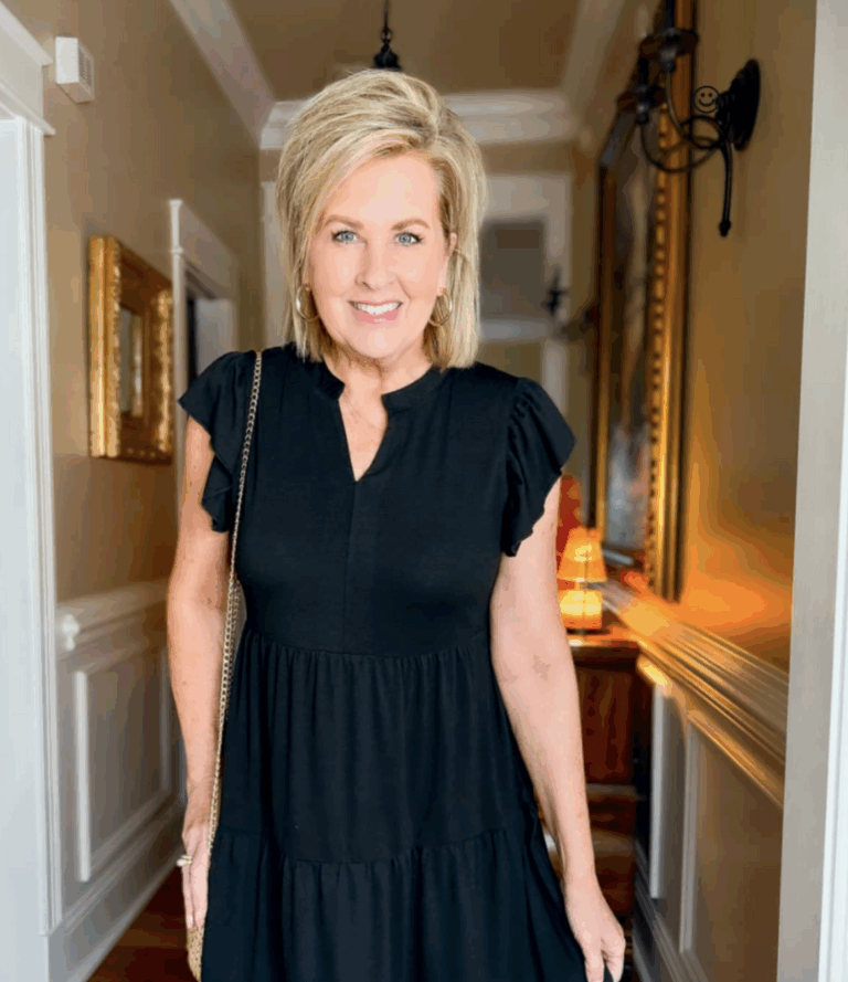 Tania wearing a black flutter sleeve dress