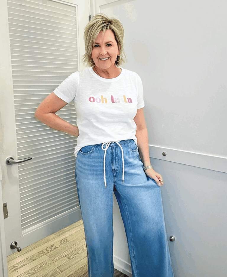 Tania wearing a white tee and drawstring jeans