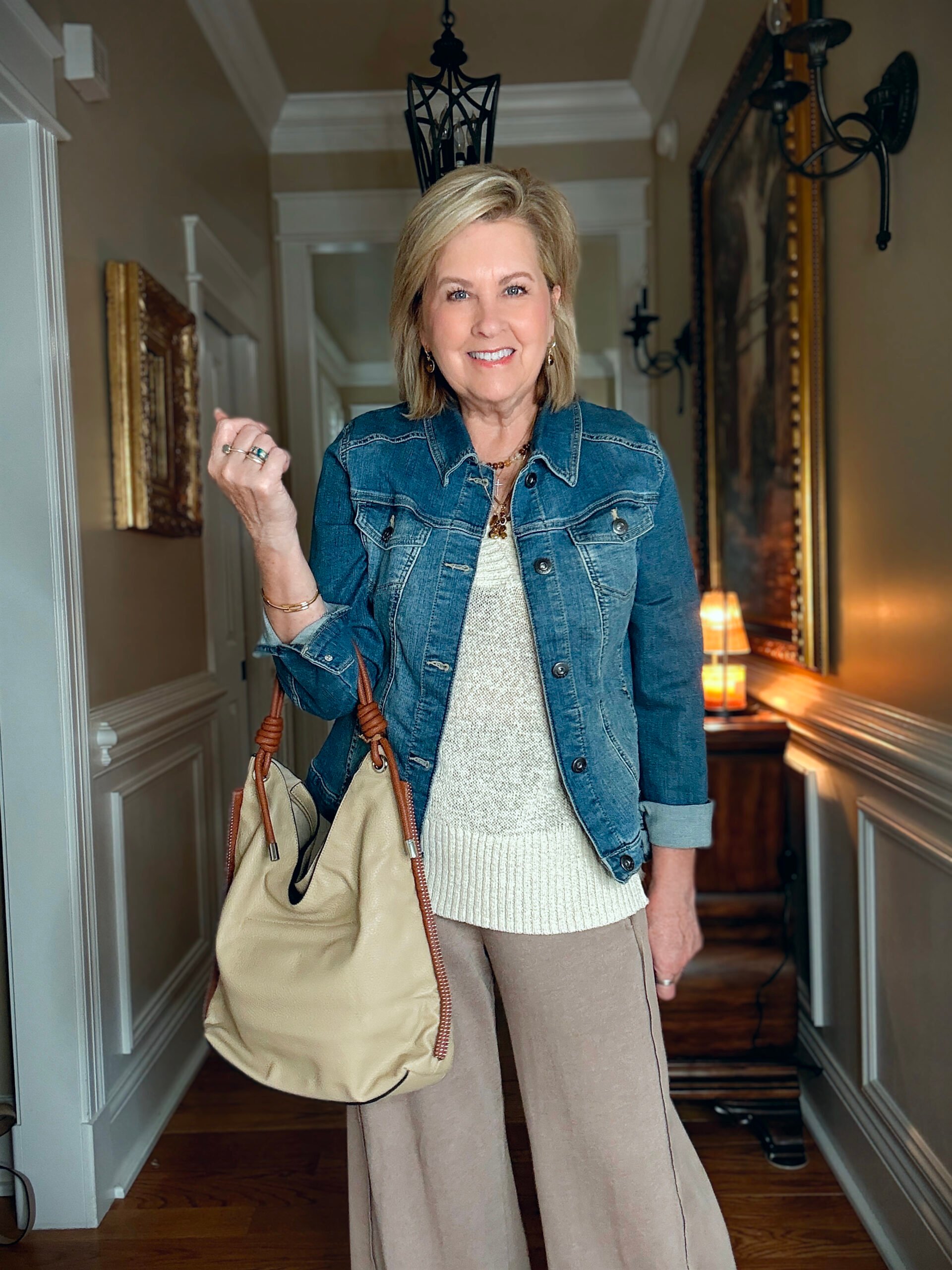 Tania is showing how to do a Summer to fall transition with jewelry, a denim jacket, and a slouchy faux suede bag