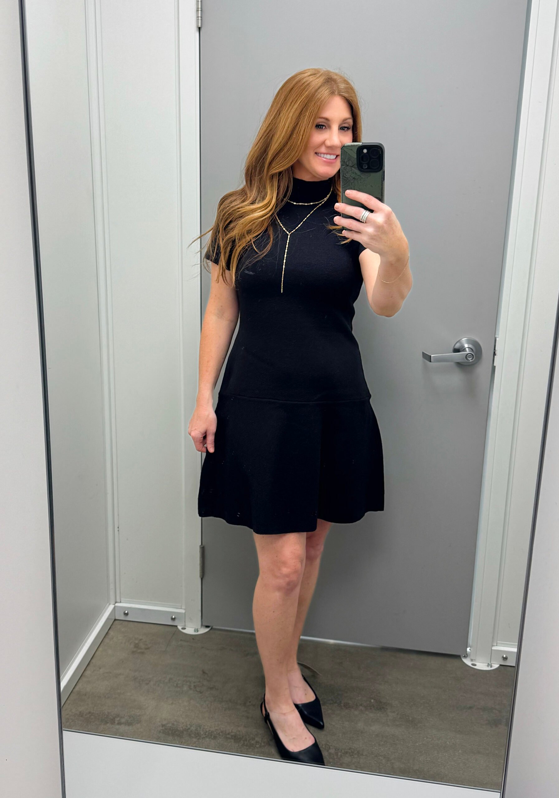 Stephanie, 5'3" petite, wearing a black dress from Walmart
