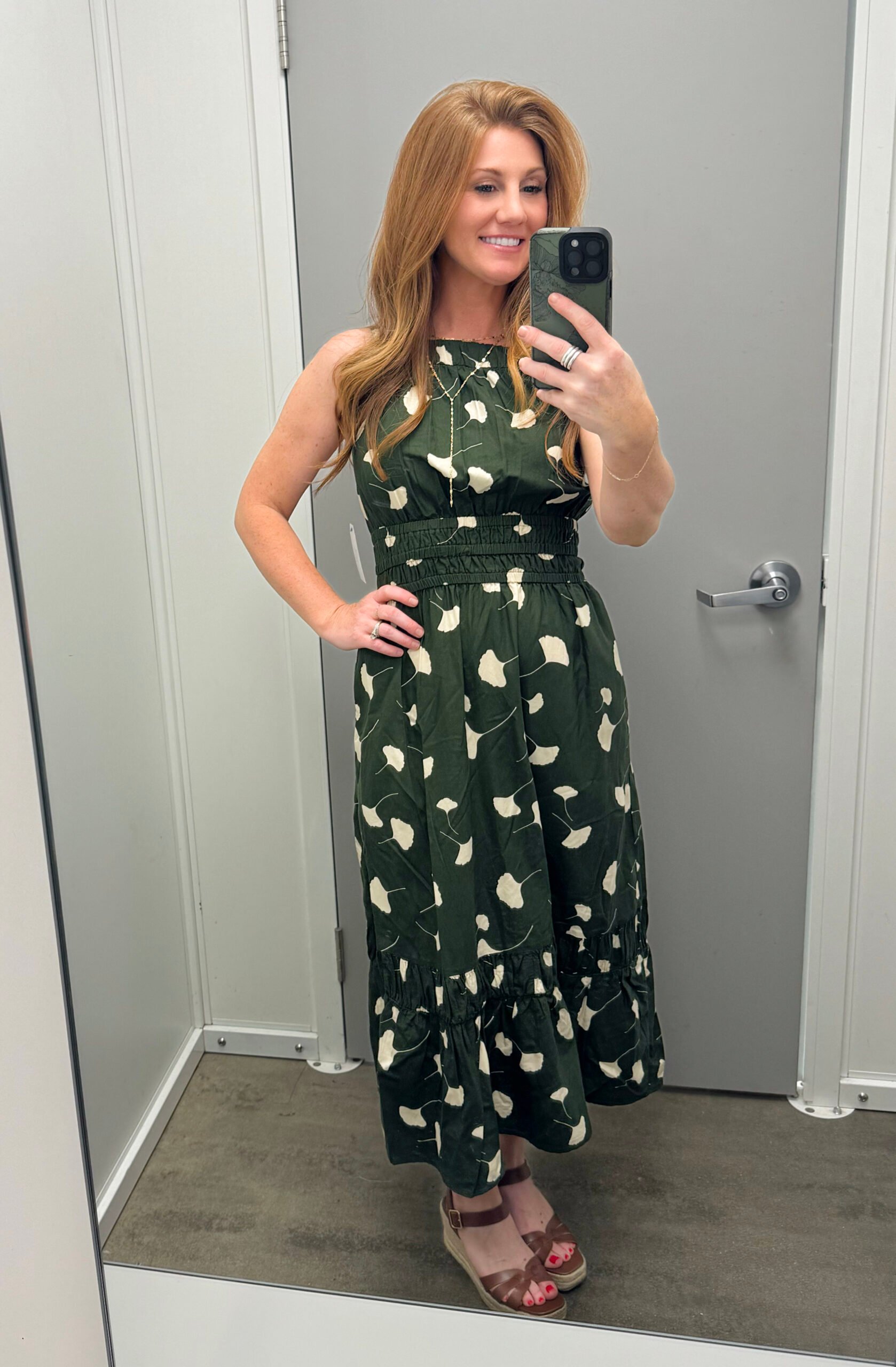 Stephanie, 5'3" petite, wearing a green printed dress from Walmart