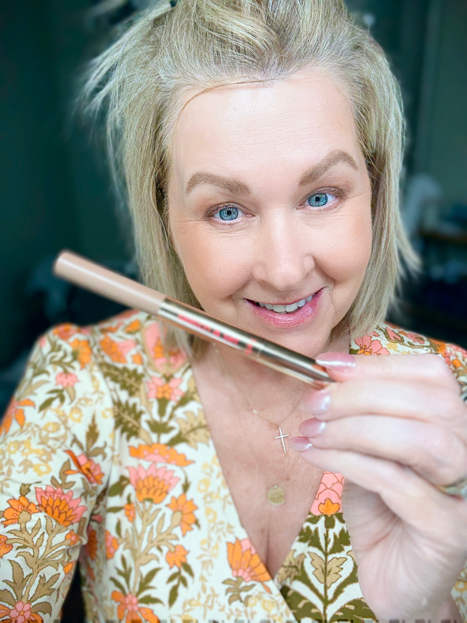 Tania showing the eyebrow pencil and gel duo from tarte