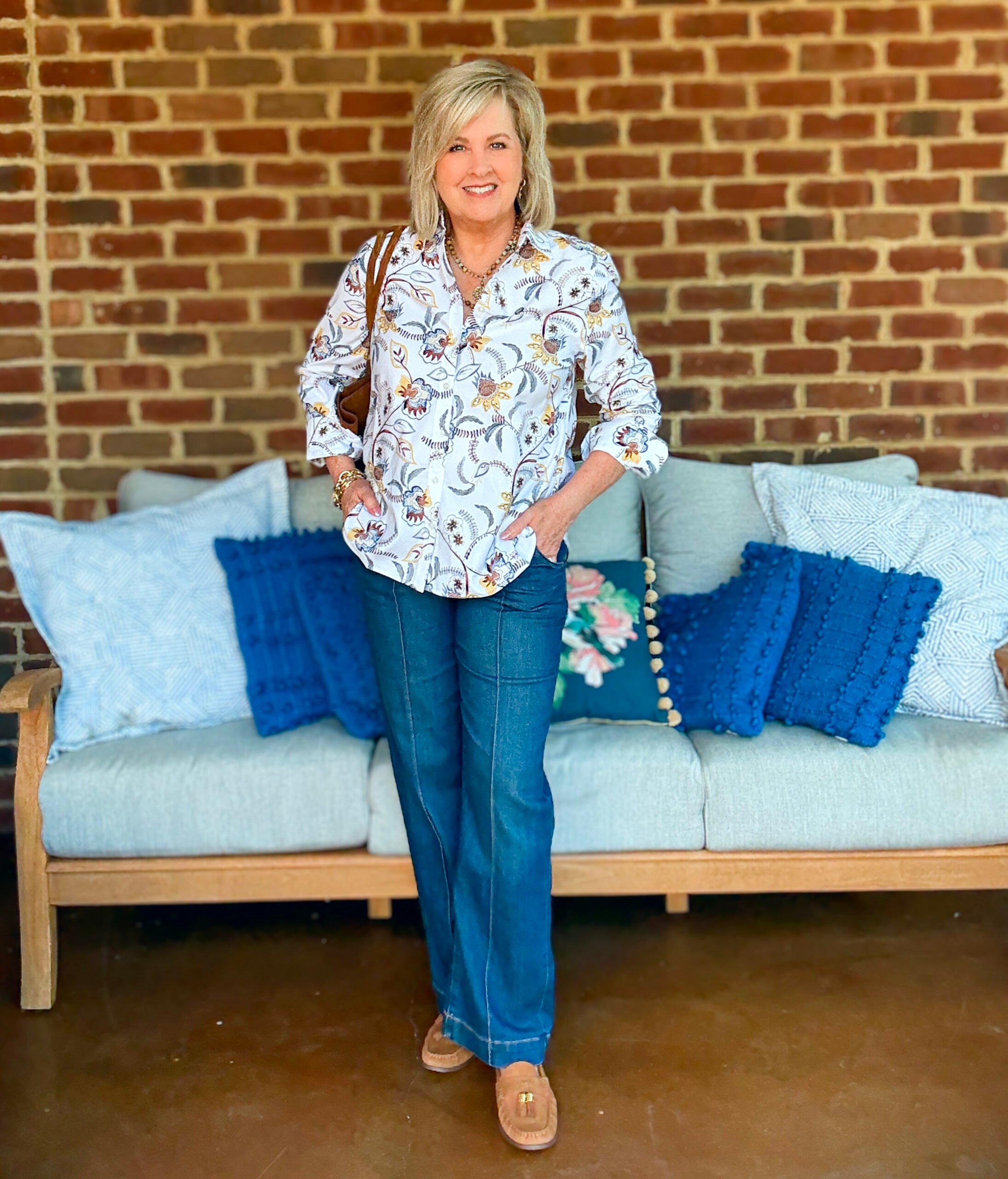 Tania Stephens wearing fall styles from Chico's - a no iron shirt, dark wash jeans, and suede accessories