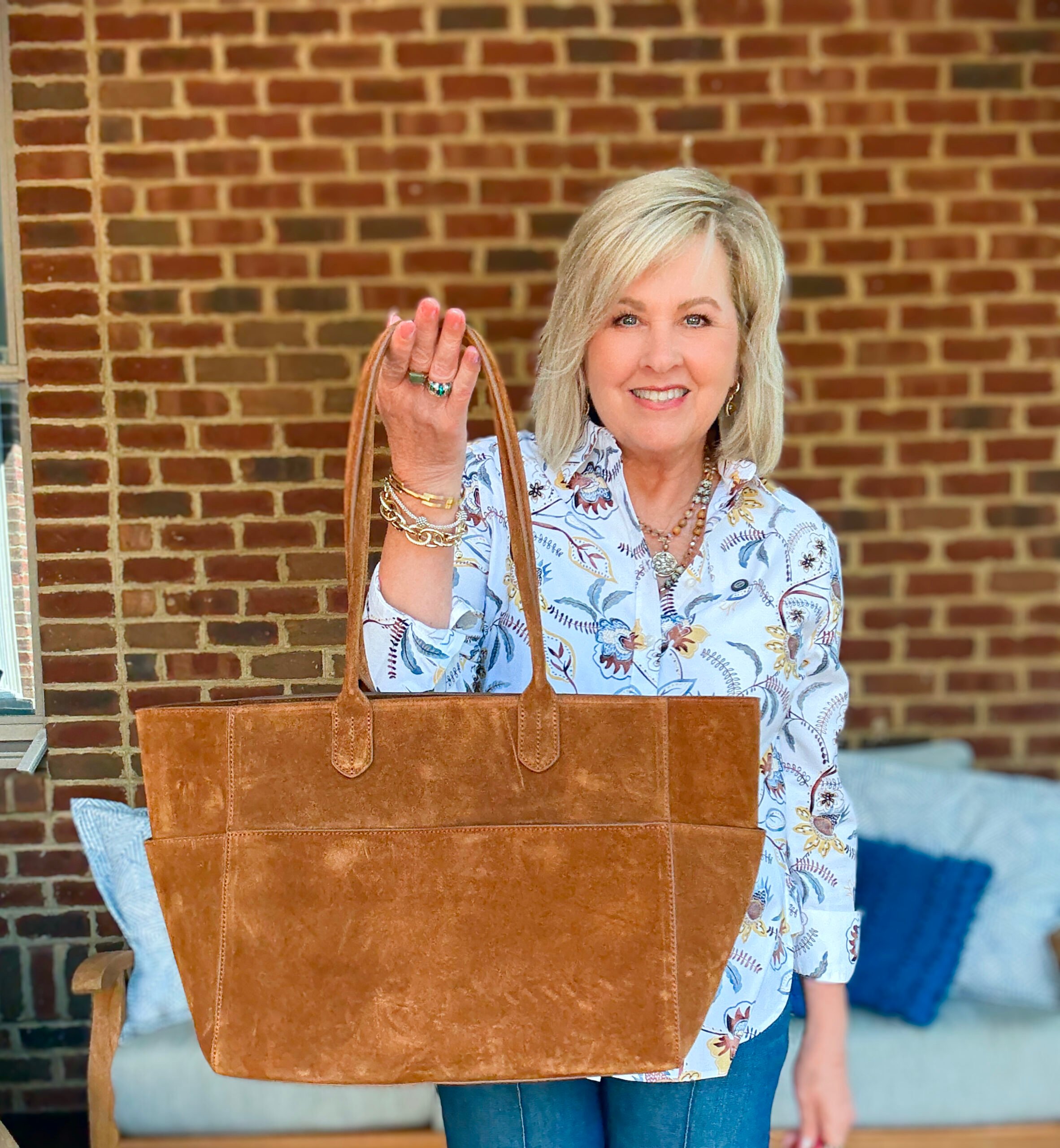 Tania Stephens wearing fall styles from Chico's - a no iron shirt and a suede handbag