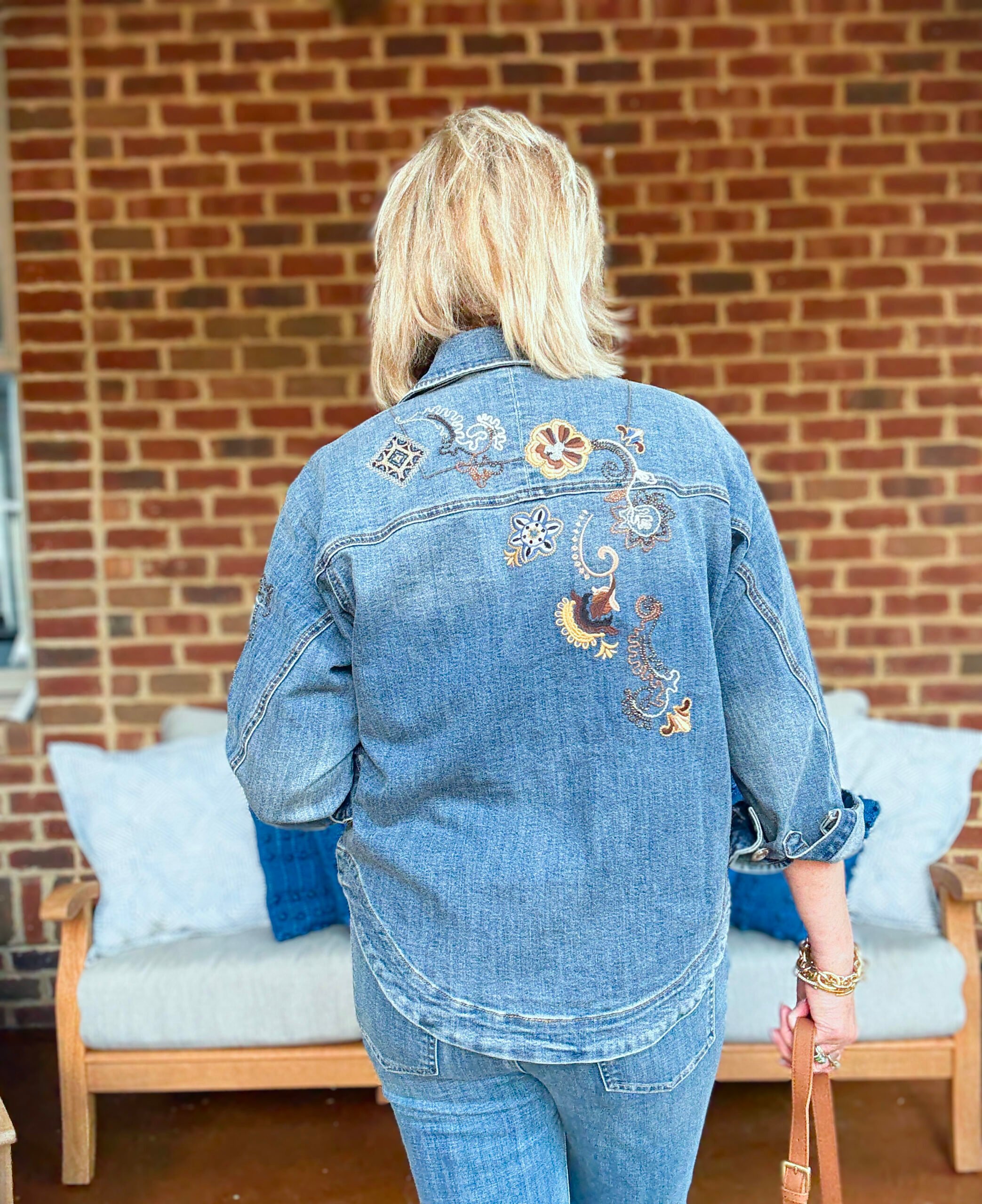 Tania Stephens wearing fall styles from Chico's - the back of a denim jacket with embroidery
