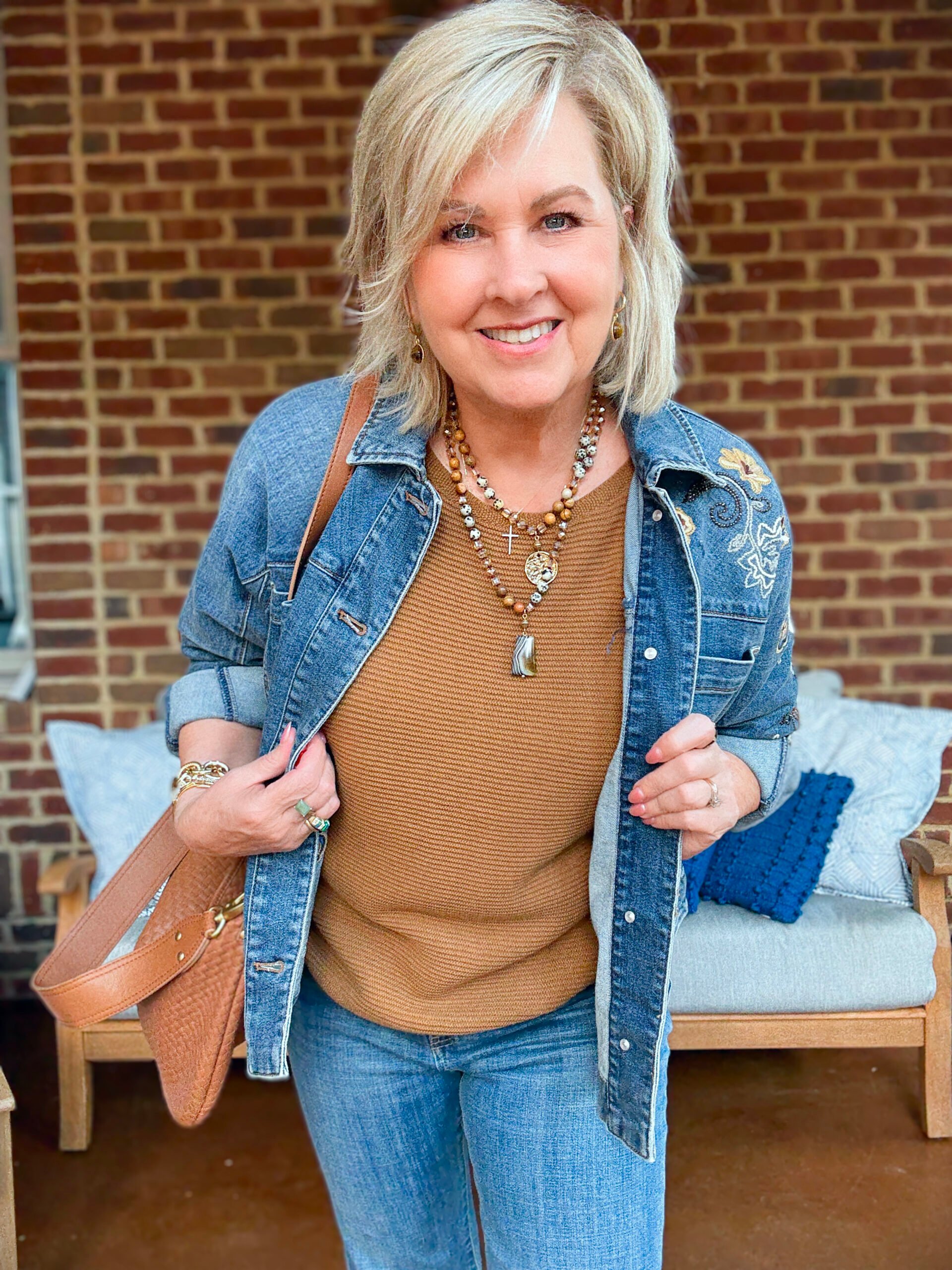 Tania Stephens wearing fall styles from Chico's - a denim jacket with a brown sweater