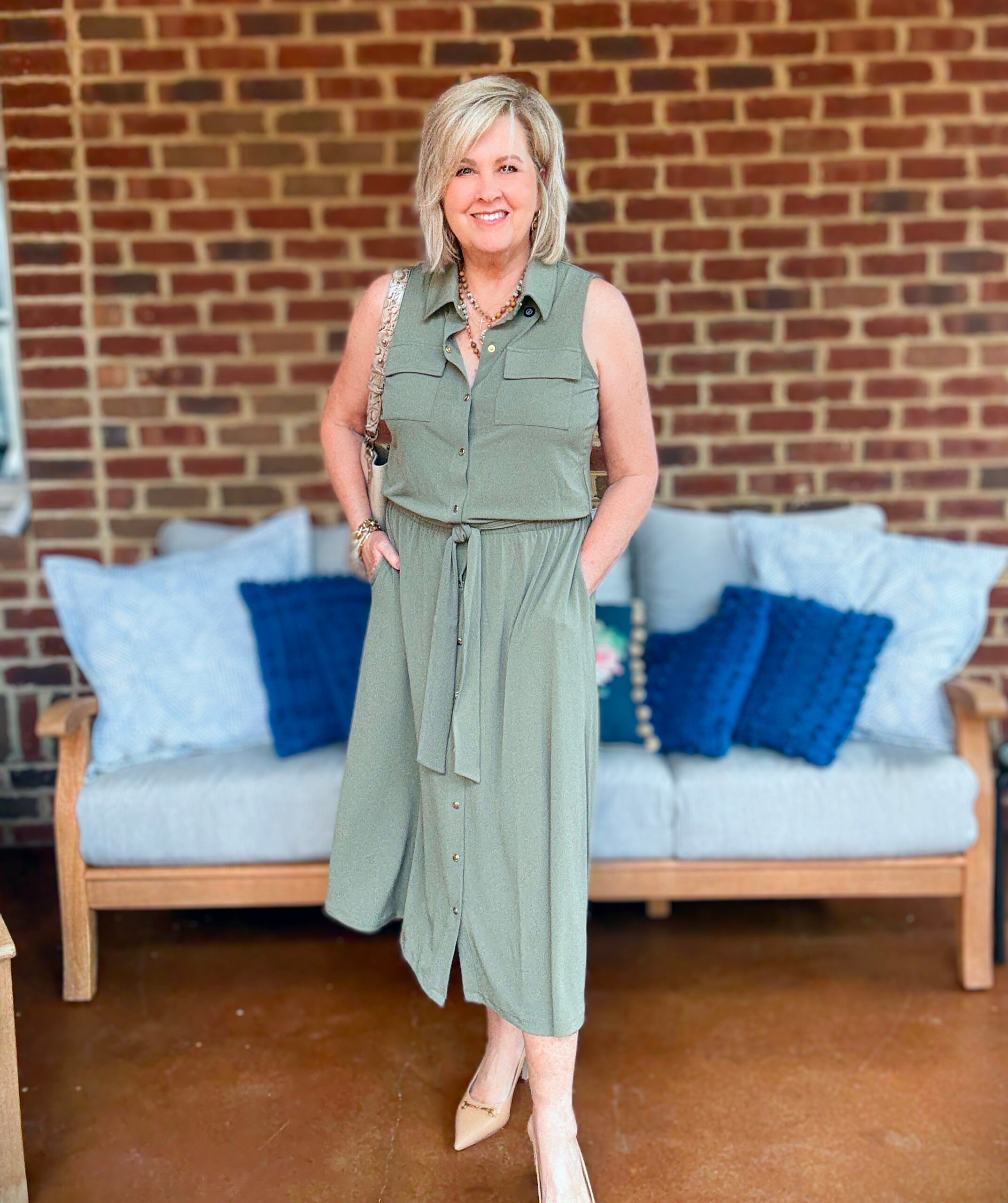 Tania Stephens wearing fall styles from Chico's - an olive knit dress and a Brahmin handbag