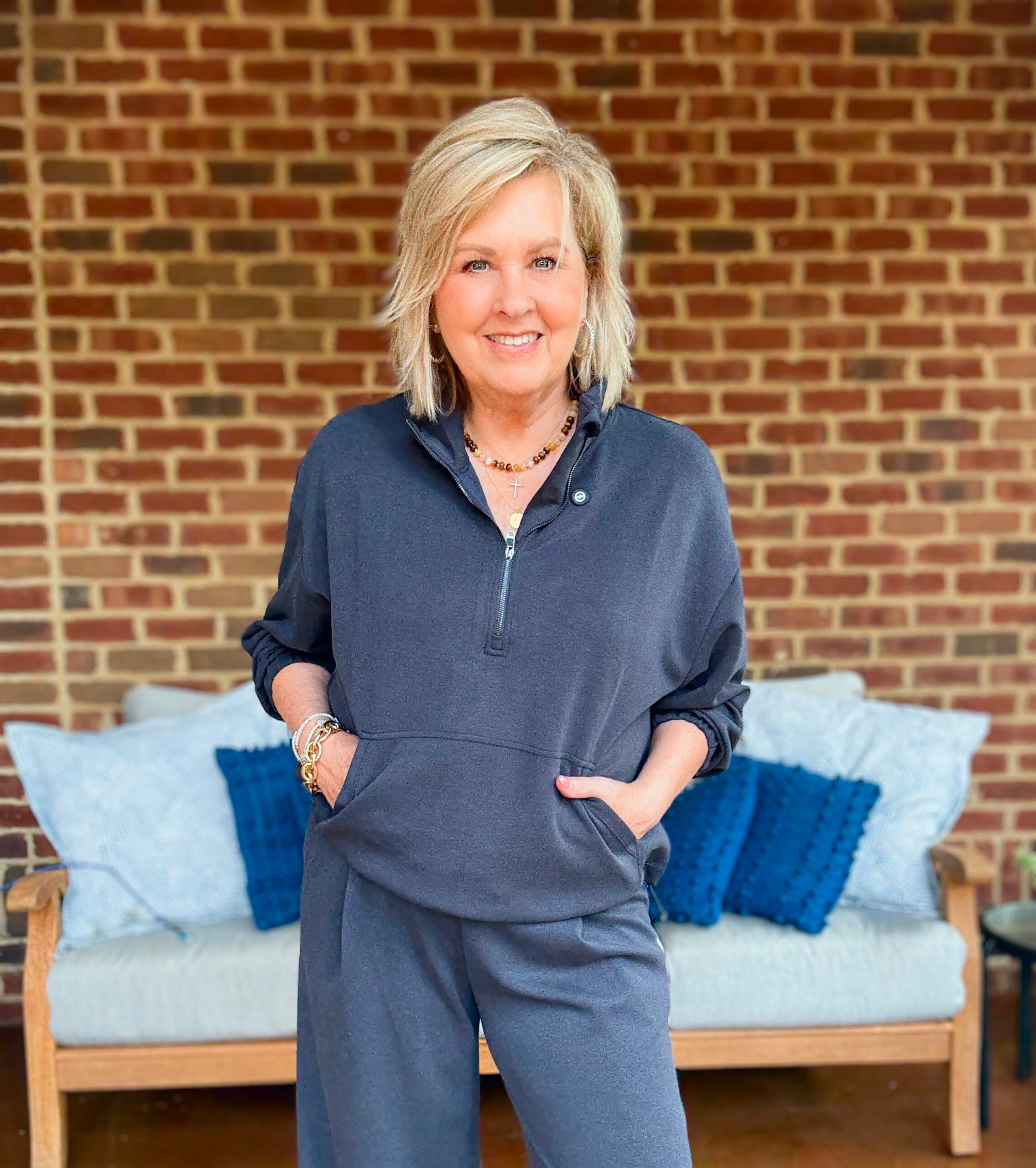 Tania wearing a navy cropped zip top 