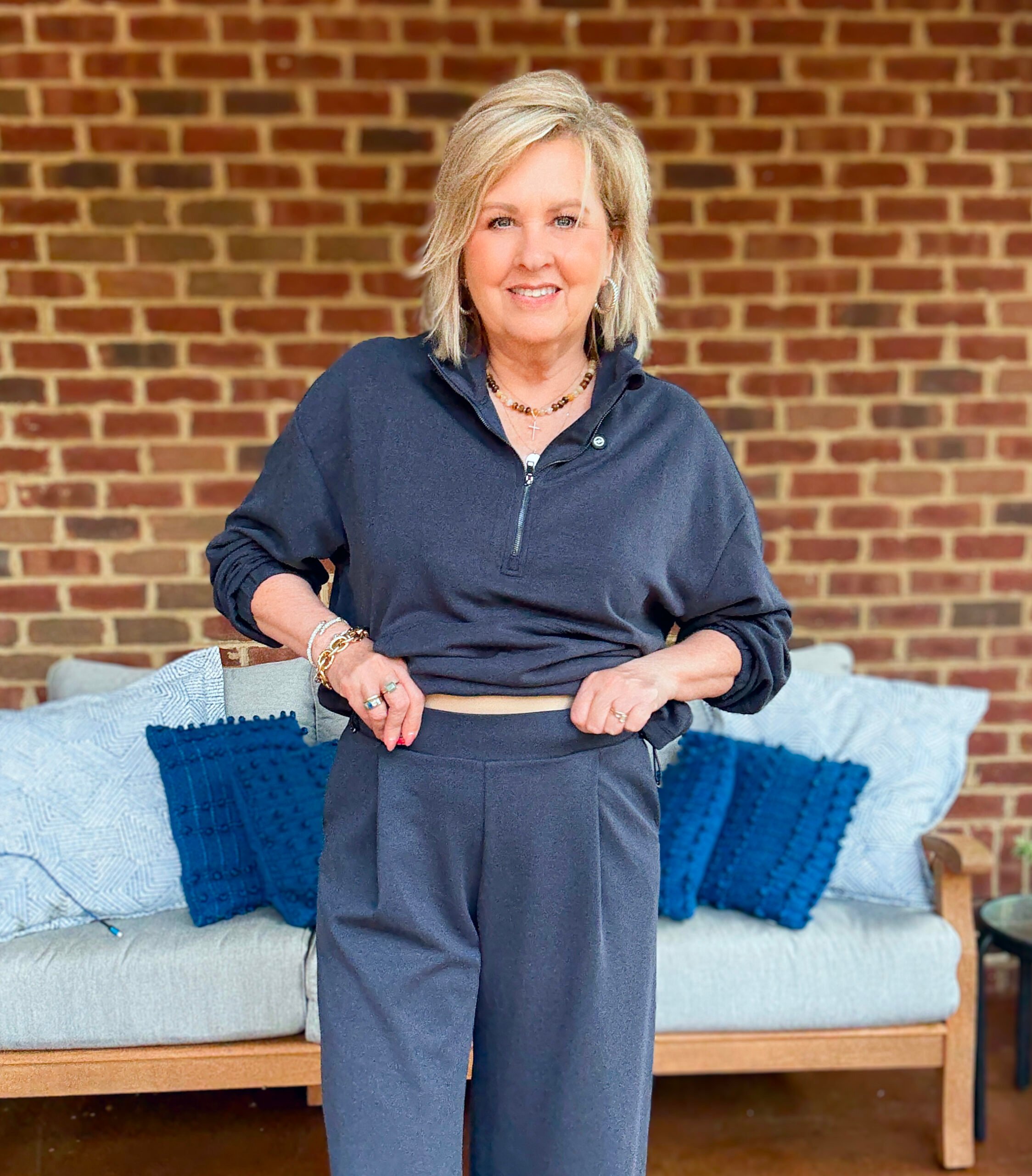 Tania wearing a navy cropped zip top and pull on pants from Amazon