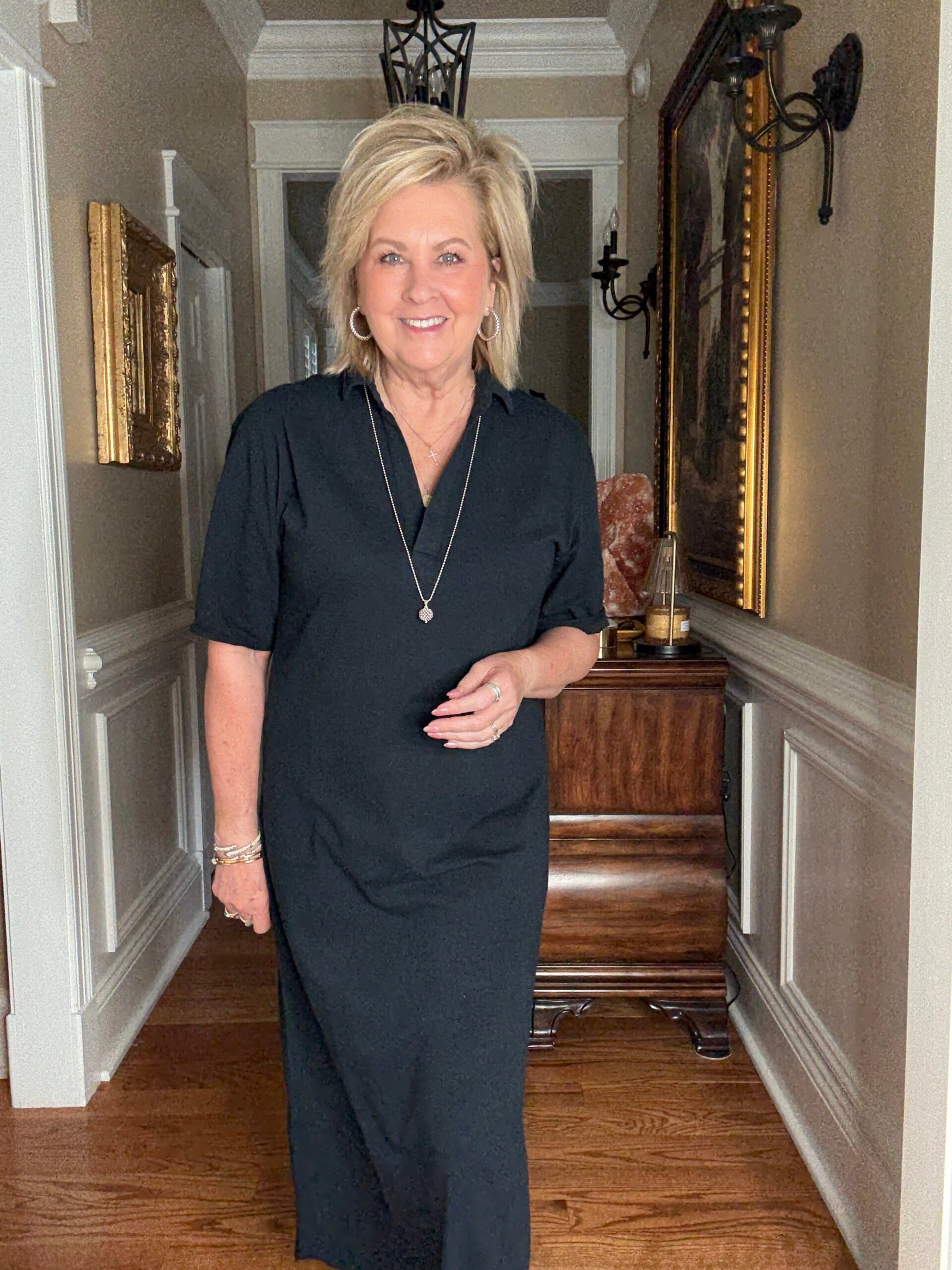Tania wearing a black polo dress from Frank & Eileen