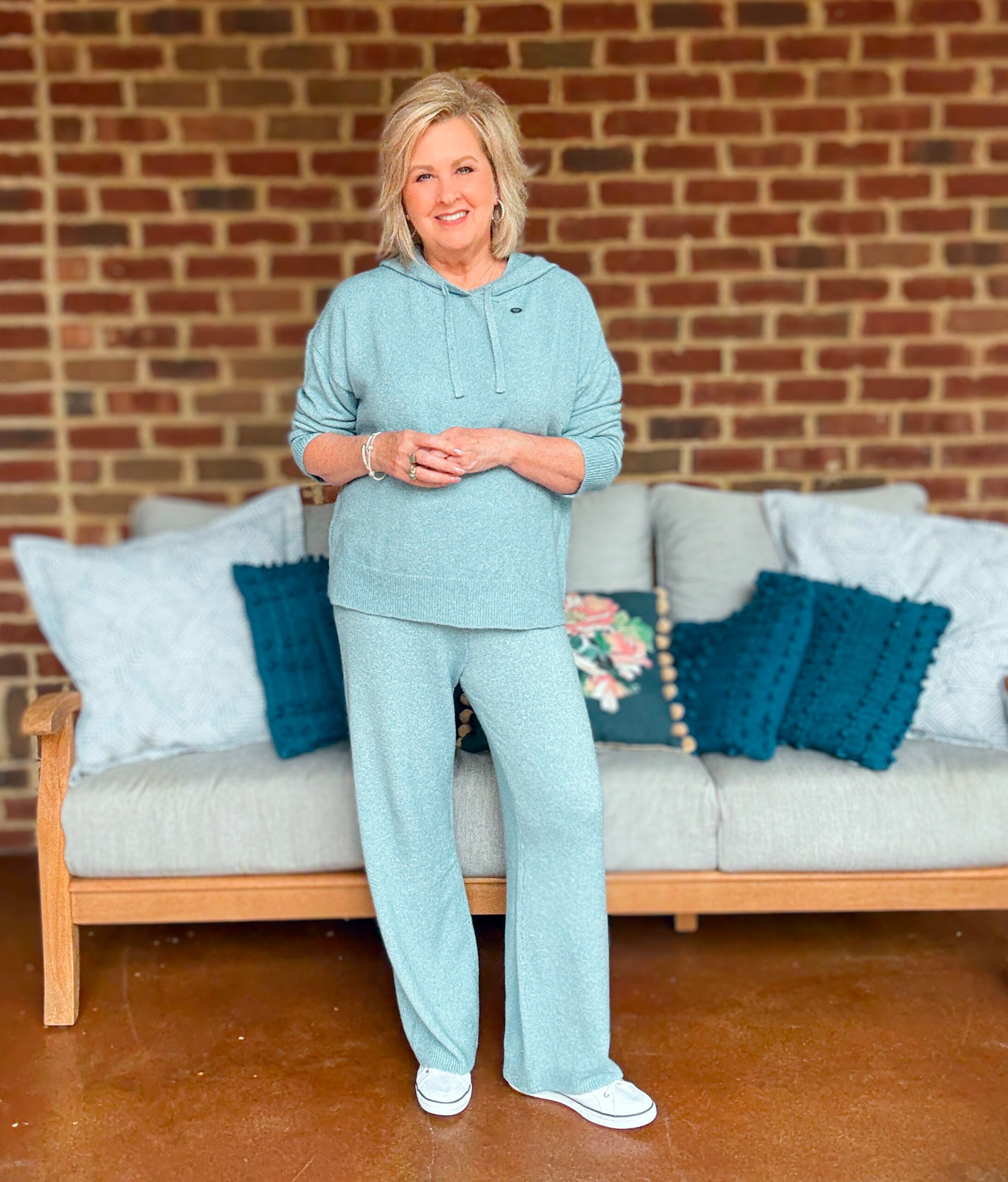 Tania wearing alight blue hoodie sweater and wide leg pant set