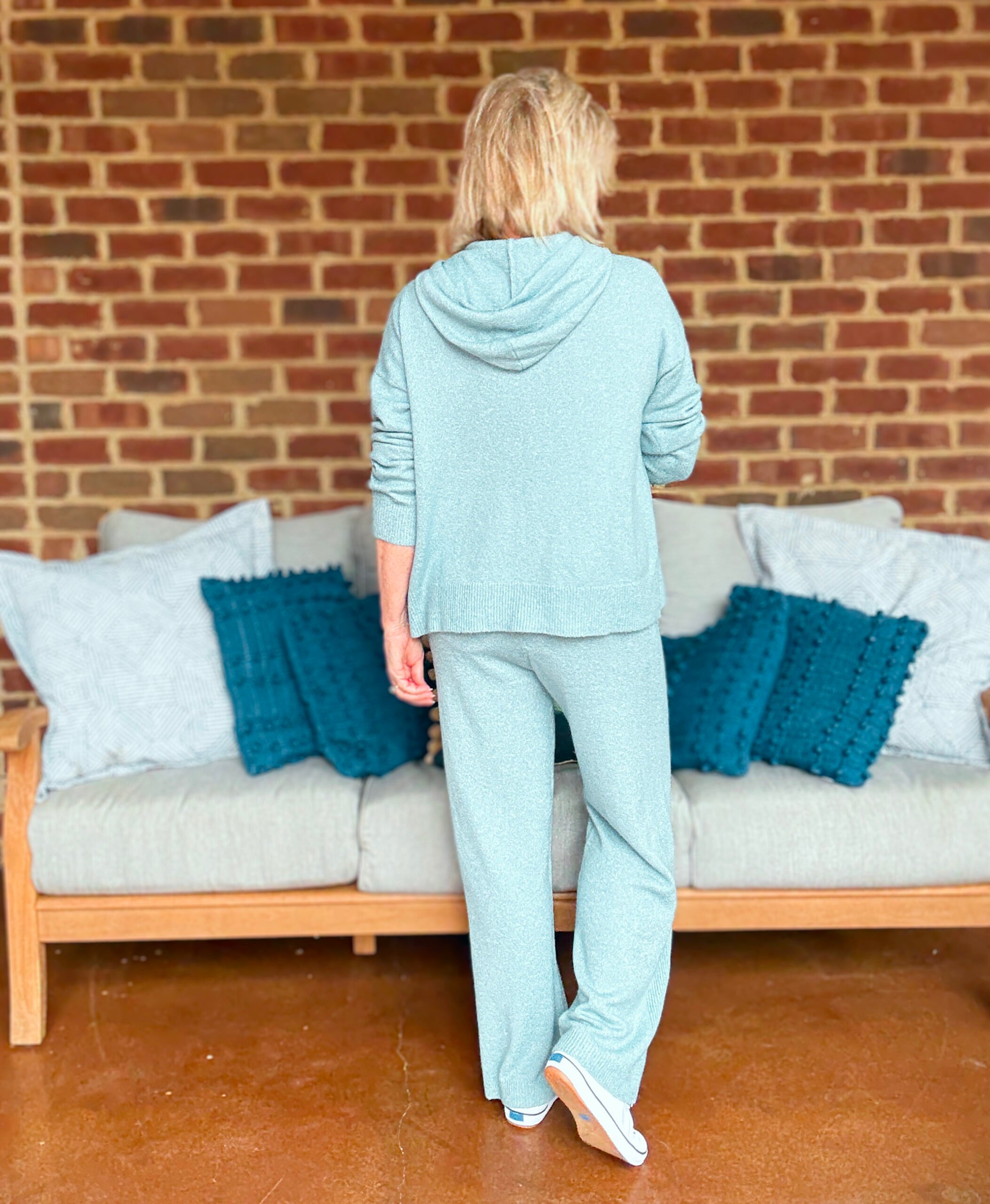 Tania wearing a light blue hoodie sweater from Walmart