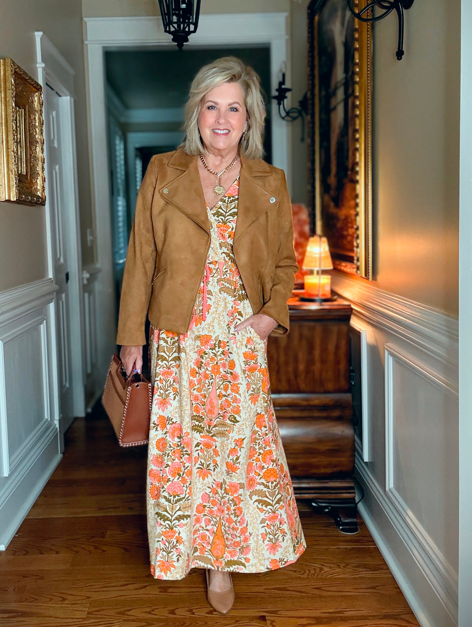 Tania Stephens wearing a beautiful floral maxi dress with a faux suede jacket
