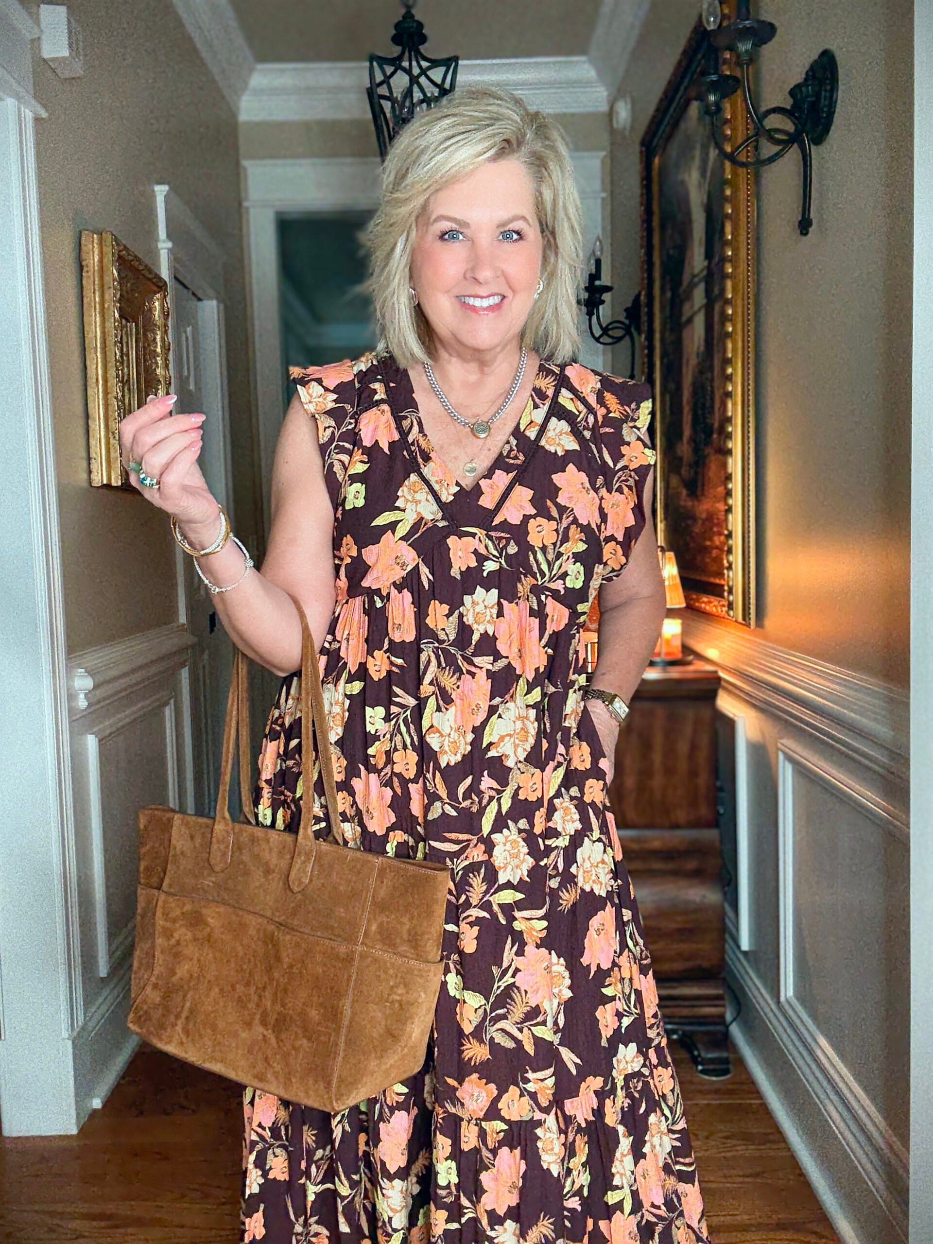 Tania wearing a V-Neck floral maxi dress from Nordstrom with a suede tote bag