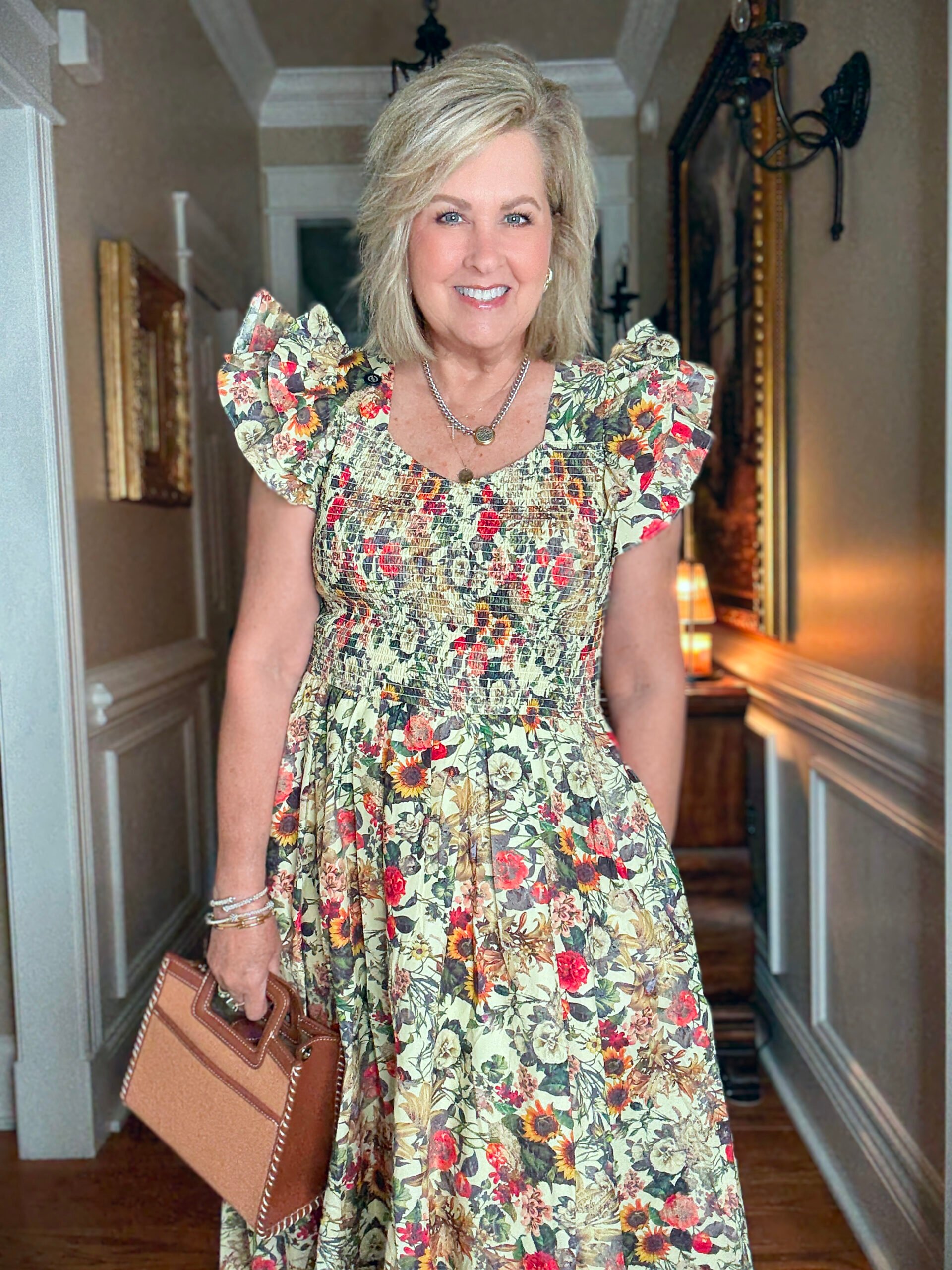 Tania wearing a V-Neck floral midi dress with ruffled sleeves