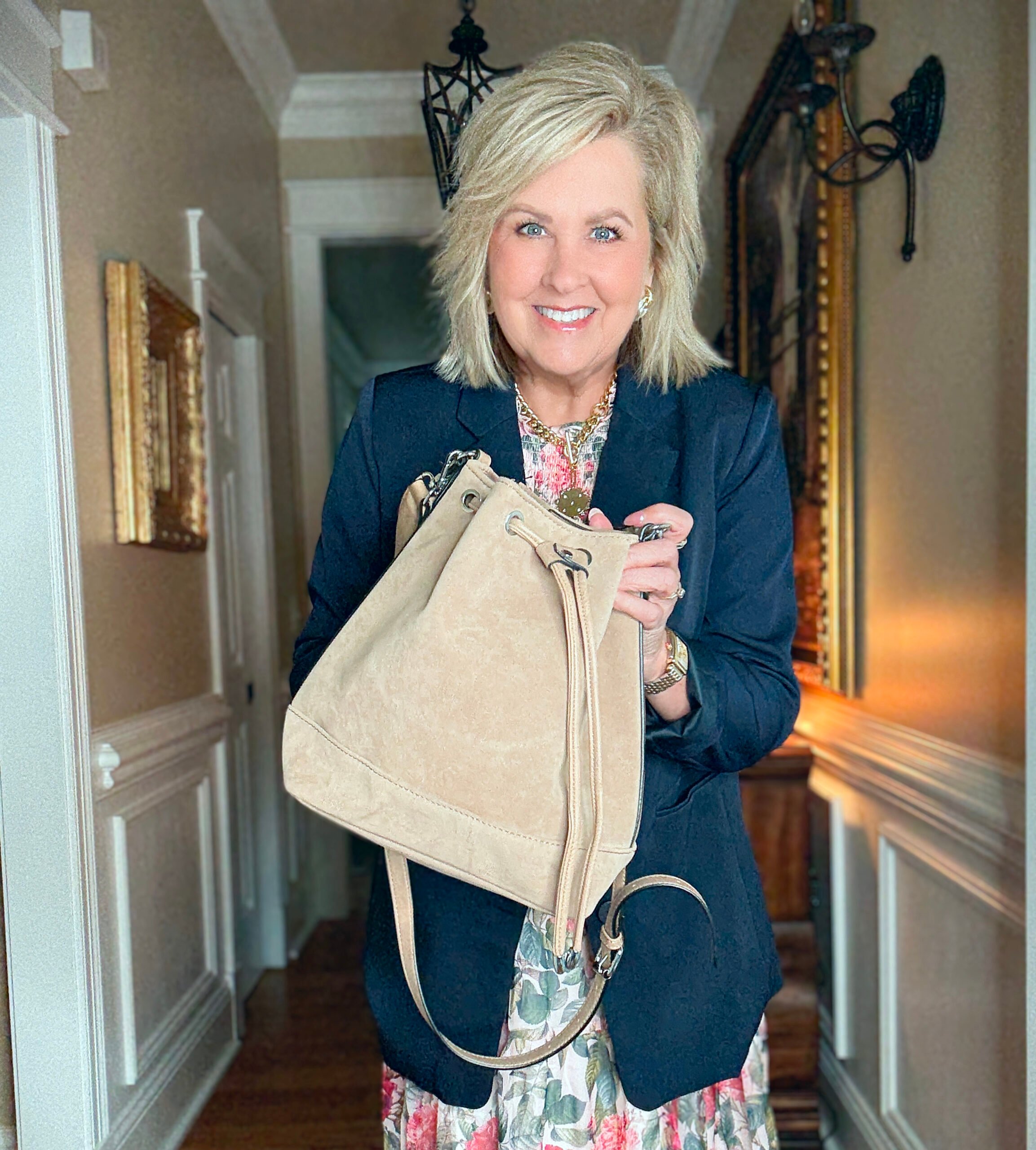 Tania showing a suede bucket bag from Amazon