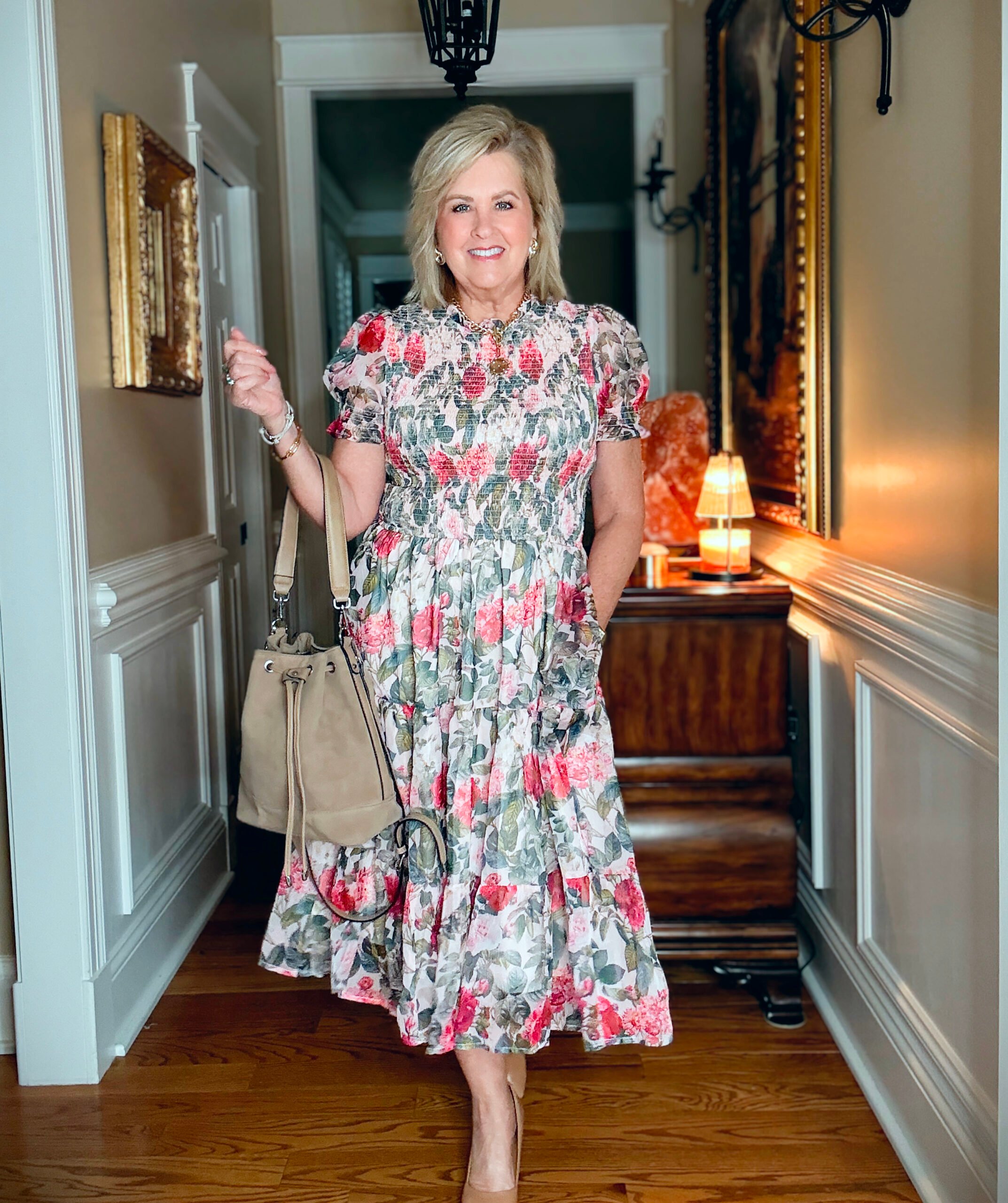 Tania wearing a crewneck floral midi dress from Ivy City