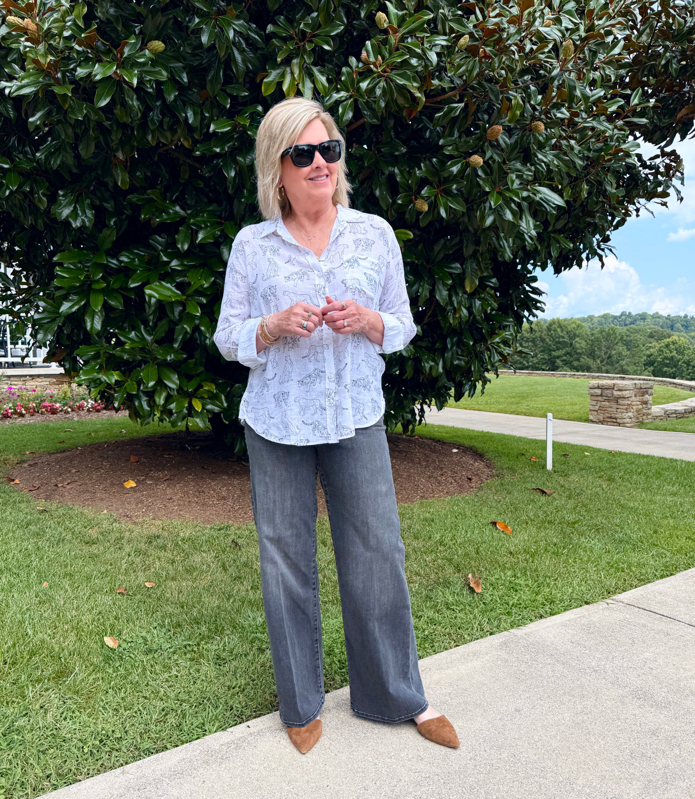 Tania Stephens wearing a white Rails shirt with cheetah print and black wide leg jeans