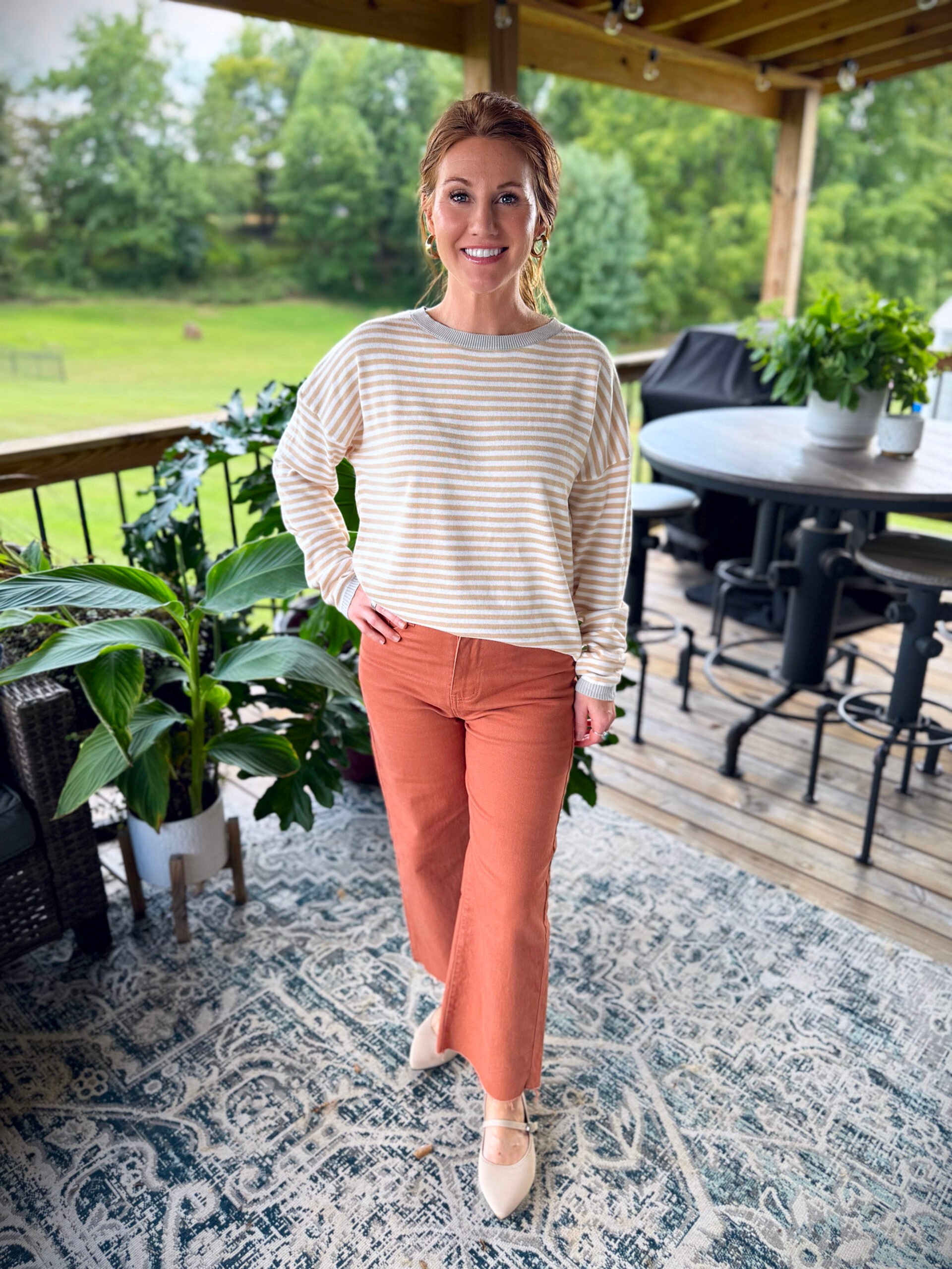 Stephanie wearing a beige striped sweater from Amazon 