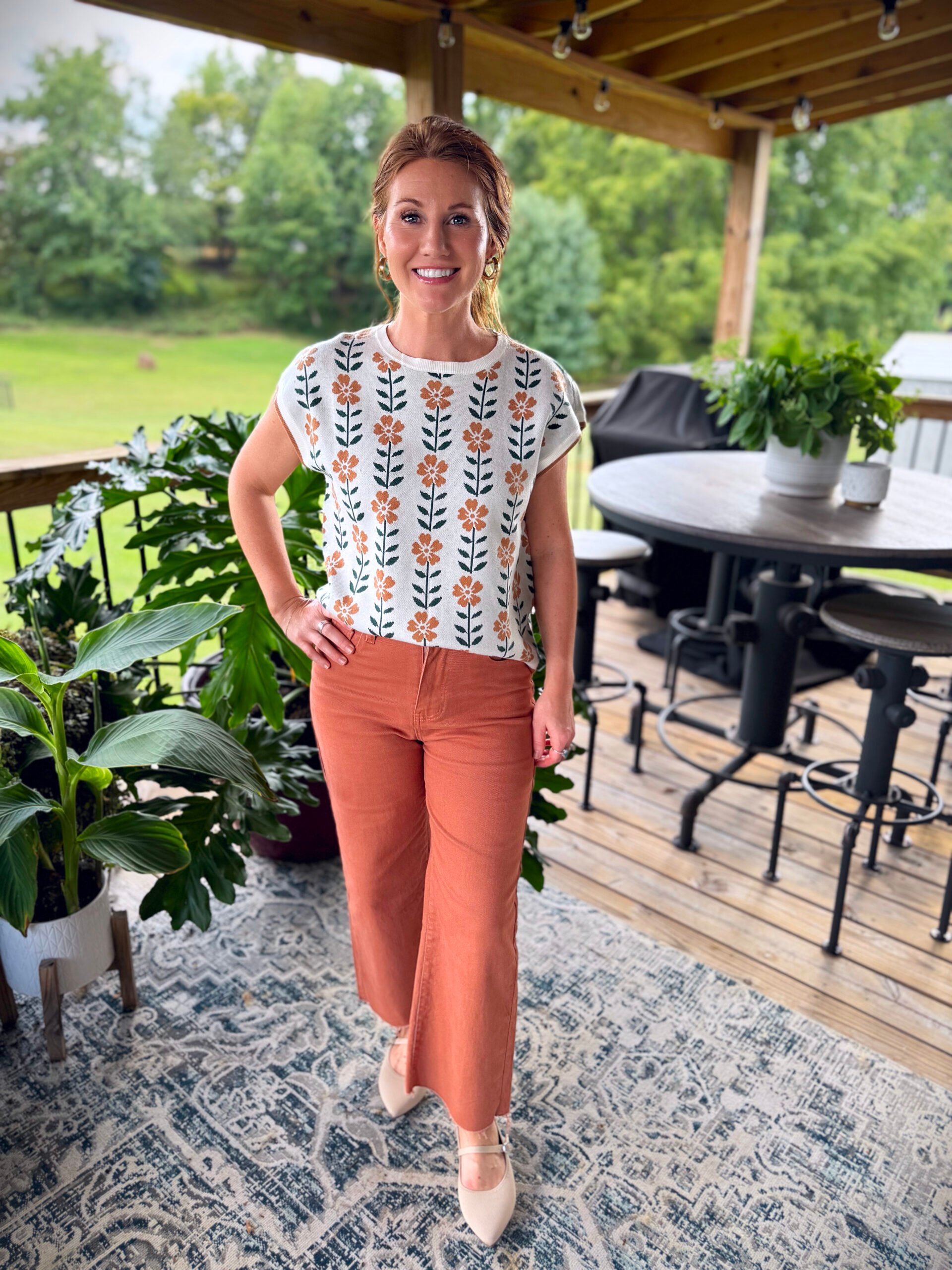Stephanie wearing a sweater from Amazon flowers