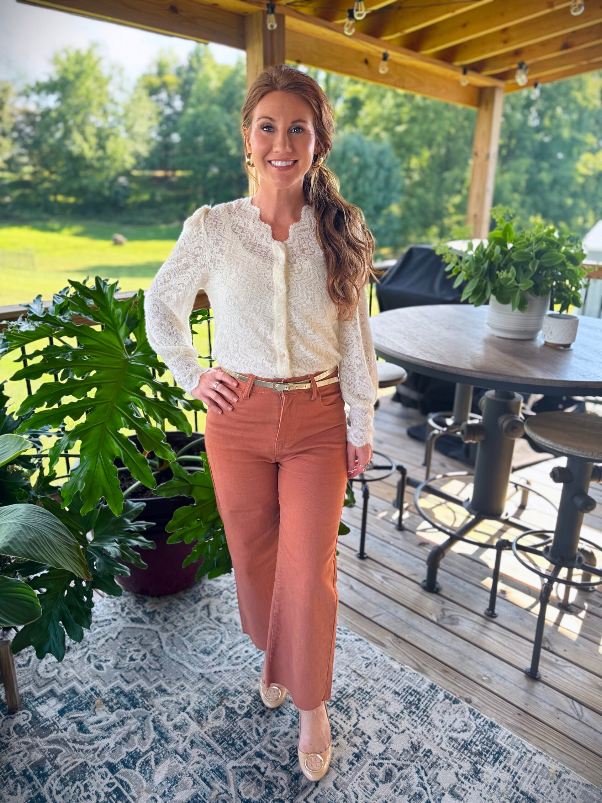 Stephanie wearing a lace button up shirt from Amazon