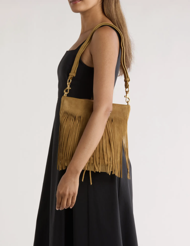 Western Style Is Trending in 2025. Here’s How to Wear It Over 50 fashion blogger tania stephens 50 is not old  fringe purse
